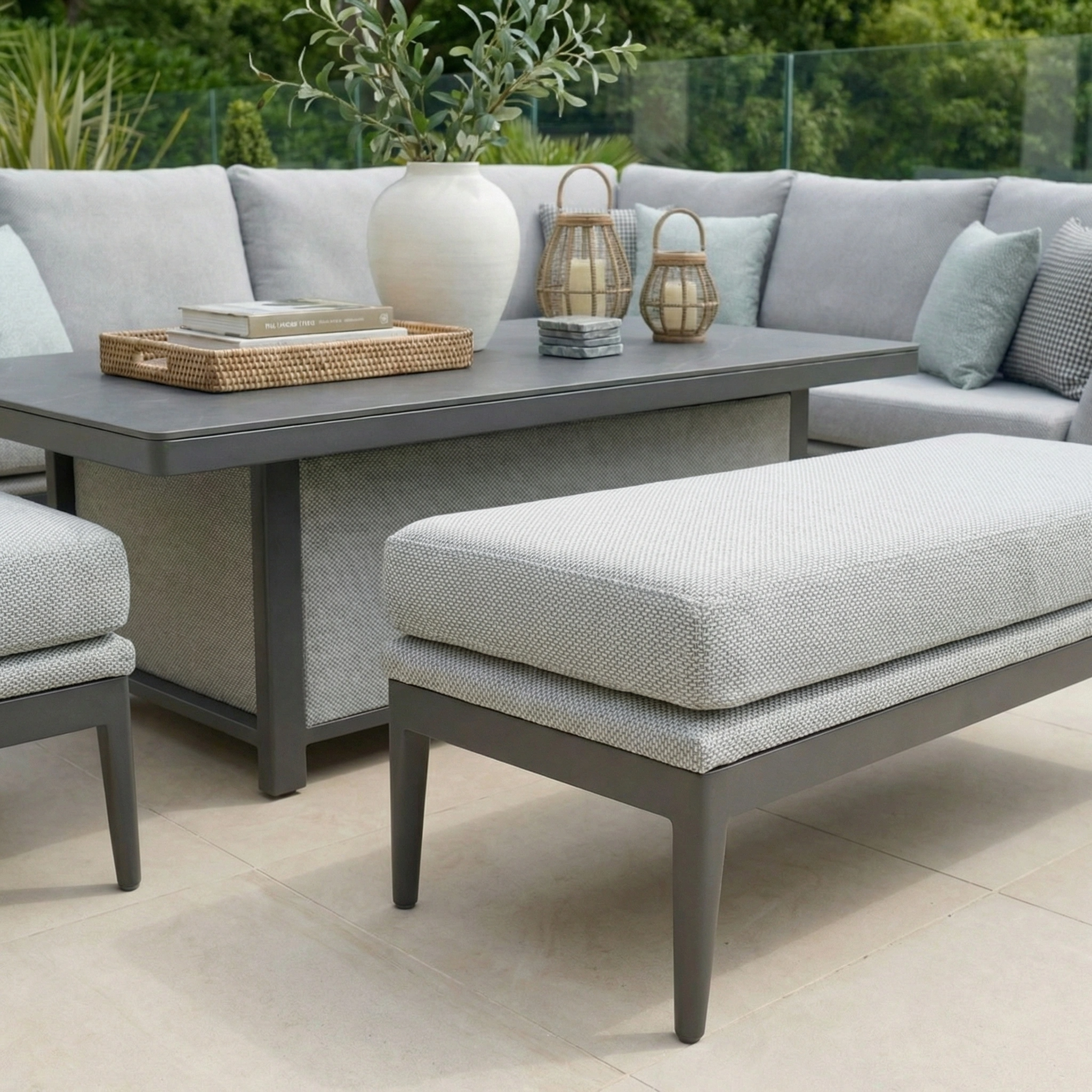 The Luna Outdoor Fabric Rectangular Corner Dining Set with Rising Table in Oyster Grey (Right Hand) features cushioned seating and a stylish design—perfect for enhancing your outdoor space.