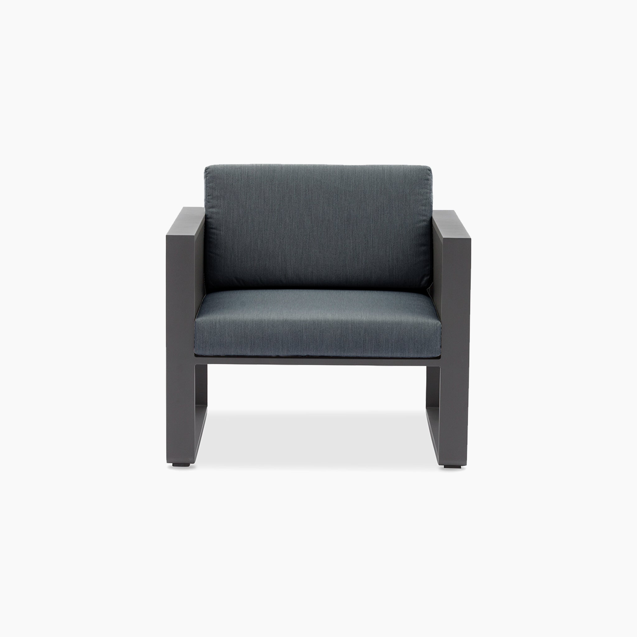 The Manhattan Armchair with Teak Gas Lift Arm in Charcoal features thick, square armrests and dark gray Olefin cushions, making it a stylish outdoor furniture choice against a plain white background.
