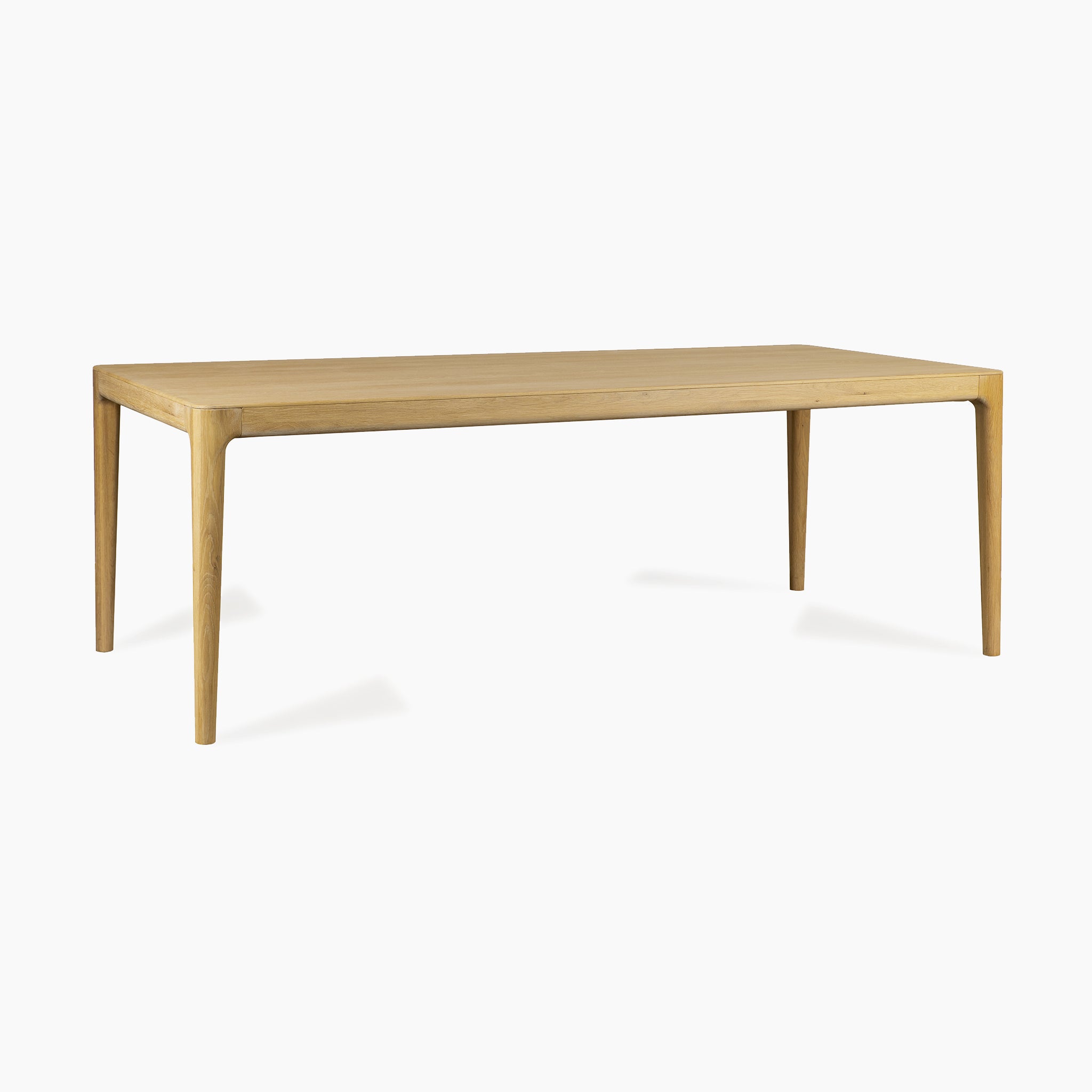 The Marlow 8 Seat Dining Set with Wooden Benches in Light Oak features a rectangular solid oak table with tapered legs, offering a contemporary yet timeless look.