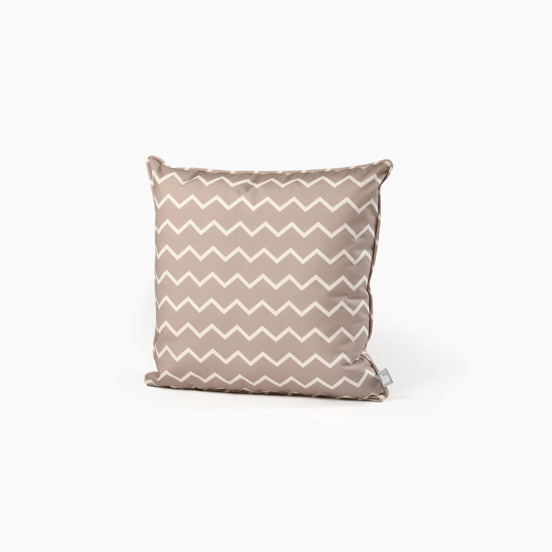 Introducing the Outdoor Zigzag B-Cushion in Silver Grey, a UV-resistant and splash-proof throw pillow featuring a stylish white zigzag pattern on a sleek beige background.