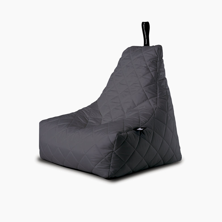 The Outdoor Quilted Mighty B-Bag in Grey is a dark grey quilted bean bag chair with a black handle loop, adding luxury and comfort to any space.