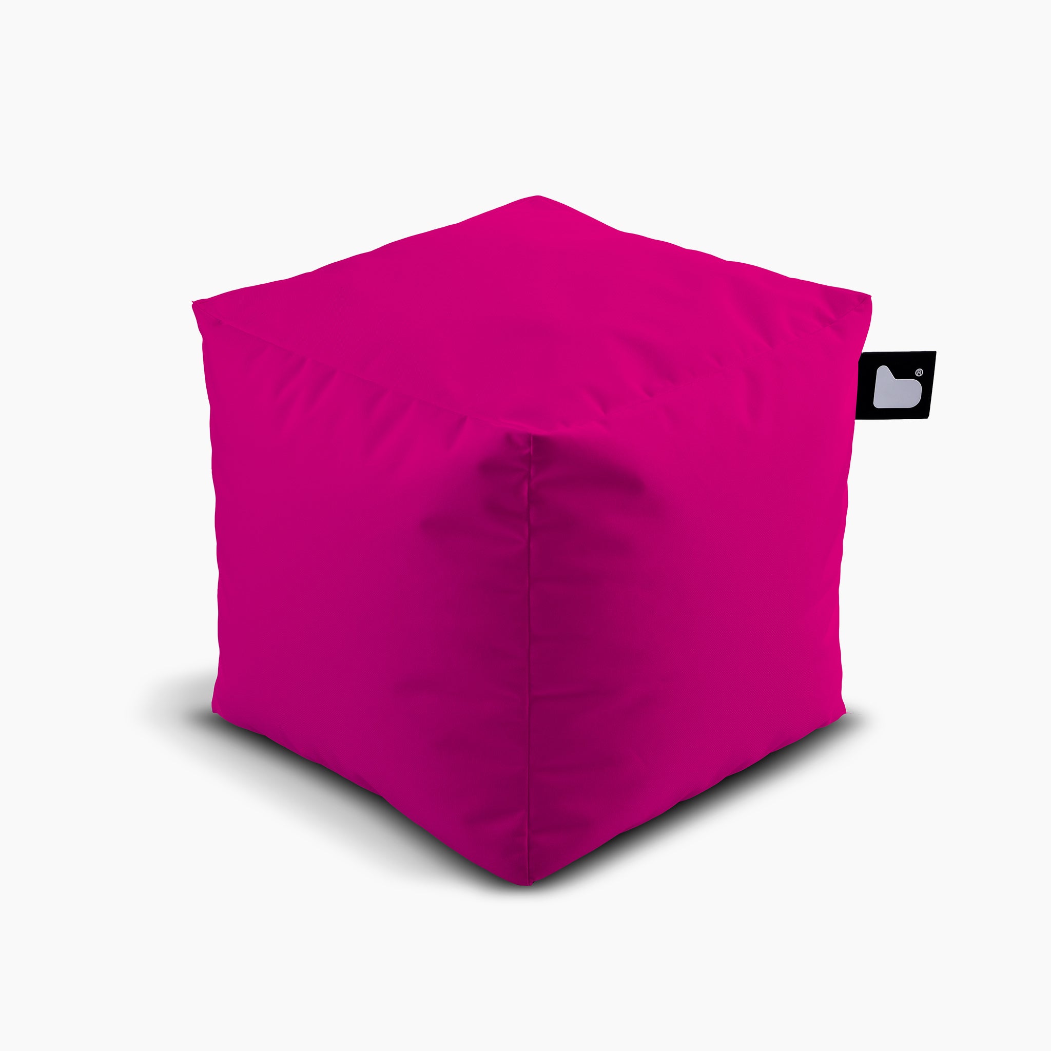 Introducing the Outdoor B-Box in Pink, a bright and cube-shaped bean bag designed for extreme lounging. It features a stylish small black and white tag on a white background. Ideal for any space, this bean bag is also waterproof, making it perfect for both indoor and outdoor use.