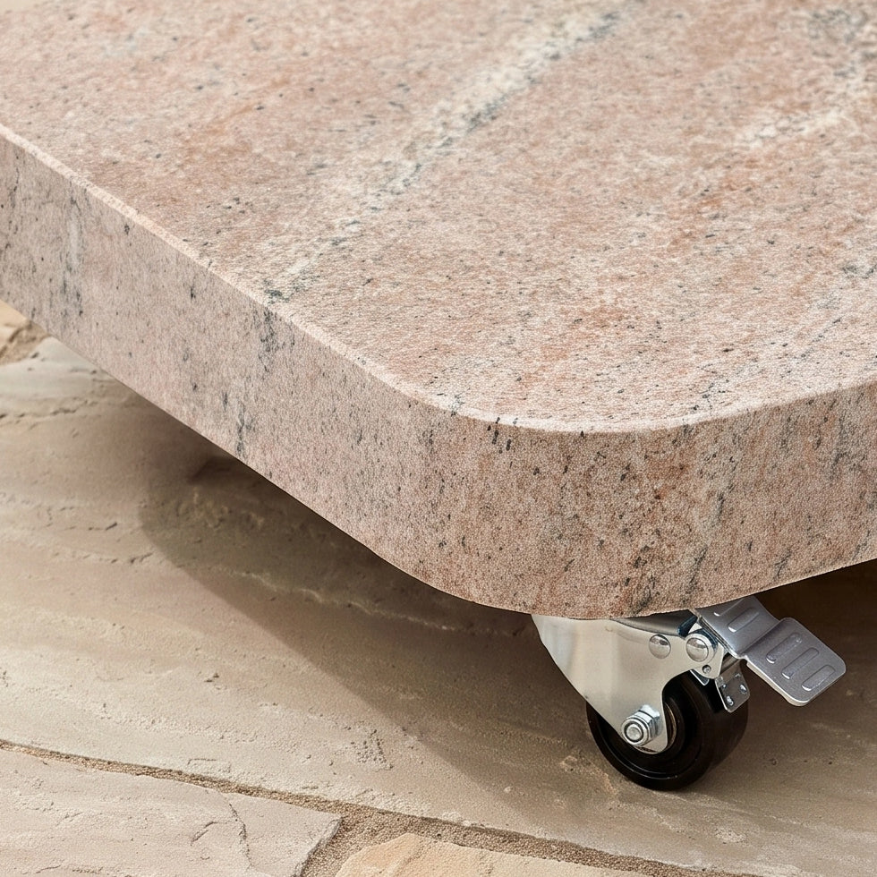 A close-up of the Nexus T2 Premium 3m Square Cantilever Parasol in Deep Taupe reveals its robust Venezia 90kg granite base with a caster wheel, designed for stability on tiled surfaces and exemplifying contemporary garden furniture construction.