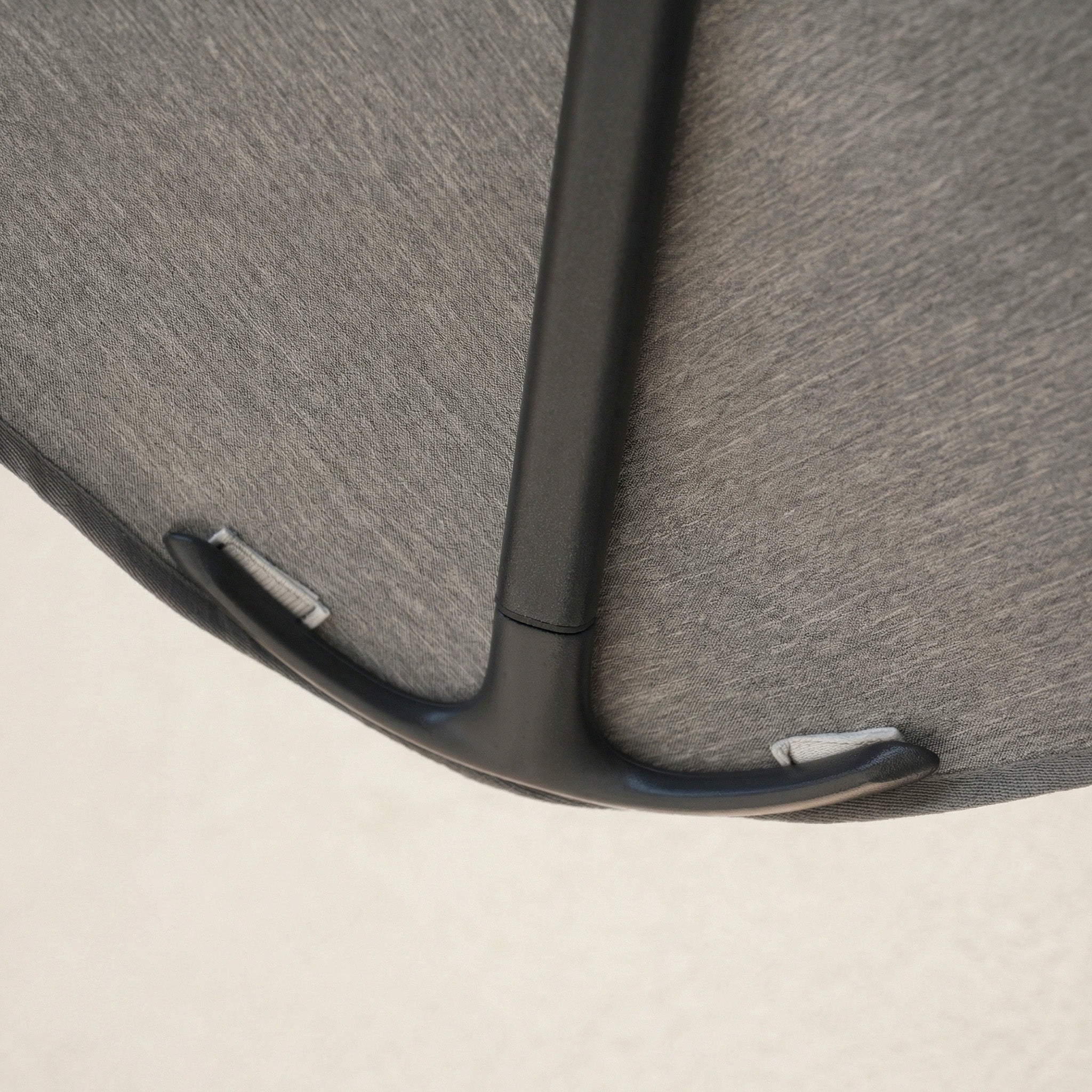 Close-up of the Nexus T2 Premium 3m Square Cantilever Parasol in Manhattan Grey, highlighting its black handle on the fabric surface and smooth 360° rotation, shown with the included 90kg granite base.