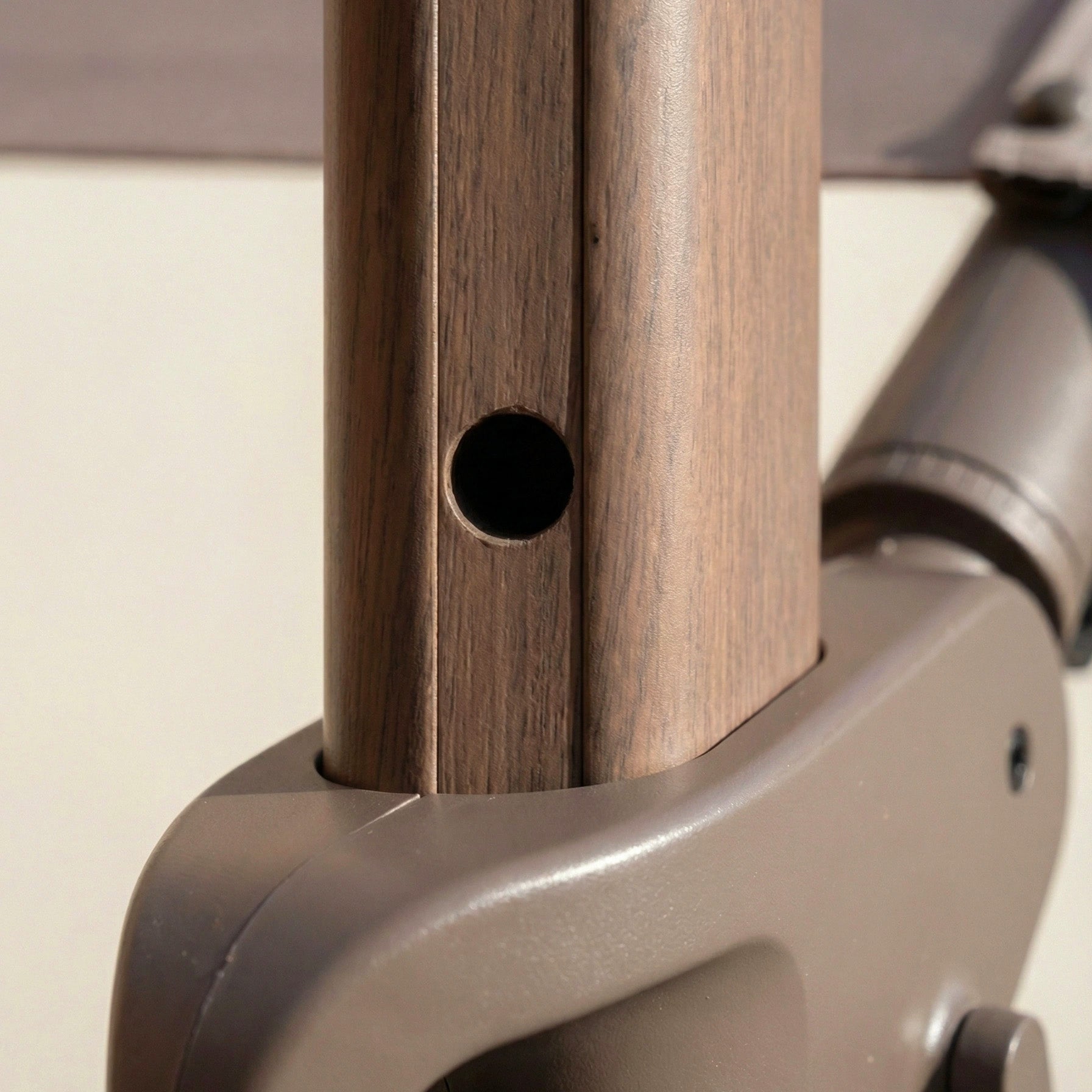 Close-up of the Nexus T2 Premium 3m Square Cantilever Parasol in Deep Taupe with a faux wood pole and 90kg granite base, ideal for modern garden furniture.