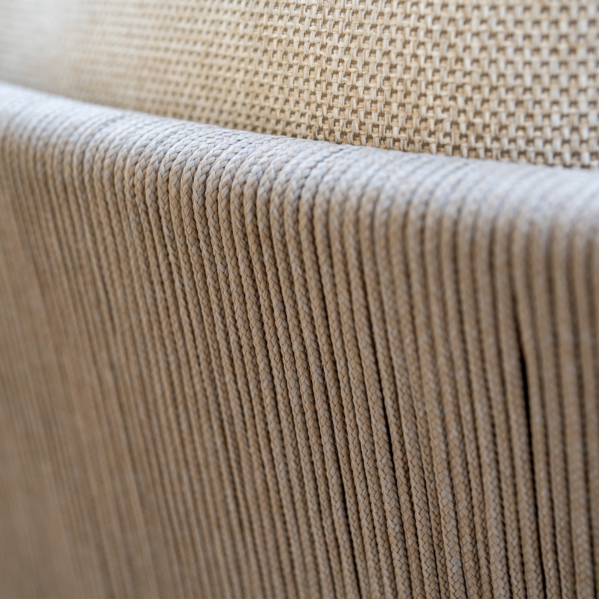 Close-up of beige woven and corded texture on furniture upholstery, part of the Noah Corner Sofa Set with Armchair in Volga Grey, highlighting the detailed pattern and quality craftsmanship.