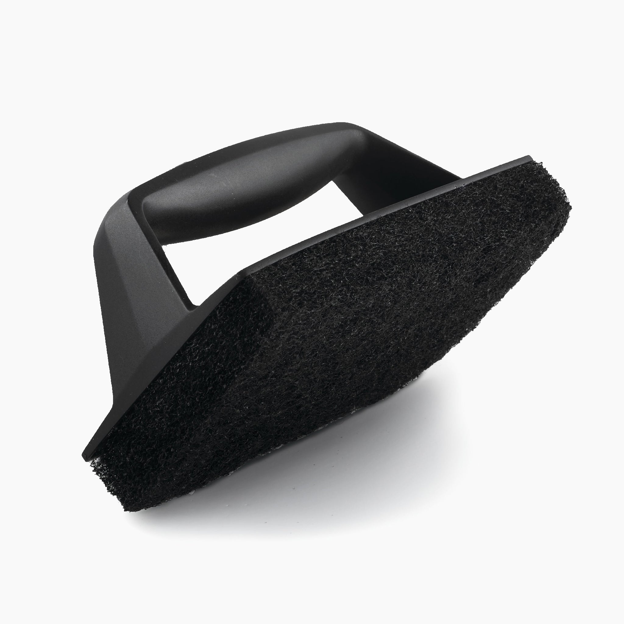 The Napoleon Abrasive BBQ Scrubber, featuring a black rectangular scrubbing surface and an ergonomic handle, is perfect for maintaining your Porcelainized Cast Iron Cooking Grids. This essential barbecue accessory makes post-grill cleanup effortless.