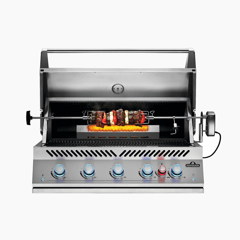 A stainless steel Napoleon 700 Series 38" Built-In Gas Grill with an open lid, showcasing a rotisserie skewer loaded with assorted meats and vegetables, enhanced by a Rear Infrared Burner for perfect searing.