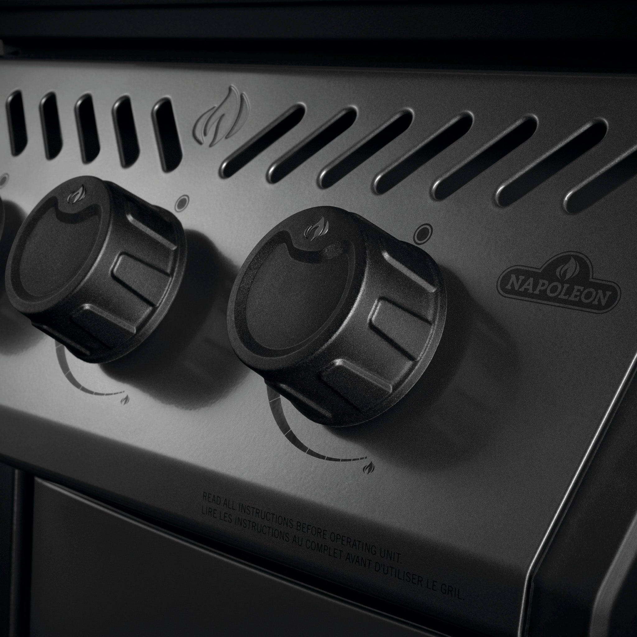 Close-up of the Napoleon Freestyle 425 Gas Barbecue's control knobs with a flame icon above them, showcasing the JETFIRE ignition system for easy startup.