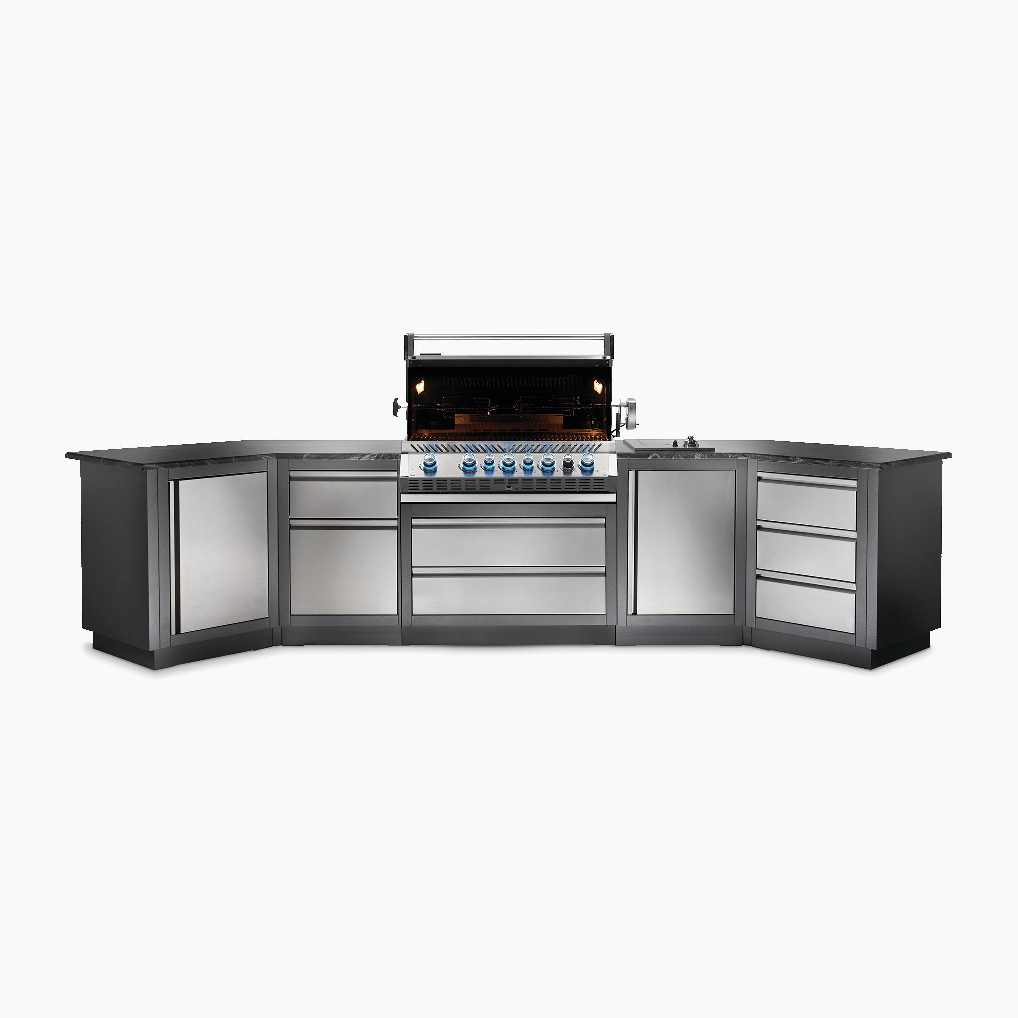 Outdoor kitchen setup featuring the Napoleon Prestige Pro 665 Built-in Gas Grill - Propane in the center, flanked by storage cabinets and drawers under a sleek countertop.
