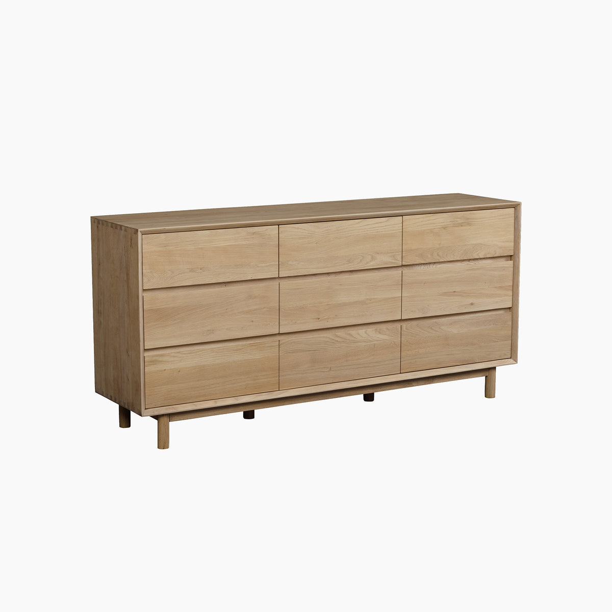 The Oslo 9 Drawer Chest in Light Oak features a simple, modern design with short legs and a clean silhouette against a white background. This elegant piece offers nine spacious drawers for versatile storage, making it ideal for contemporary interiors.