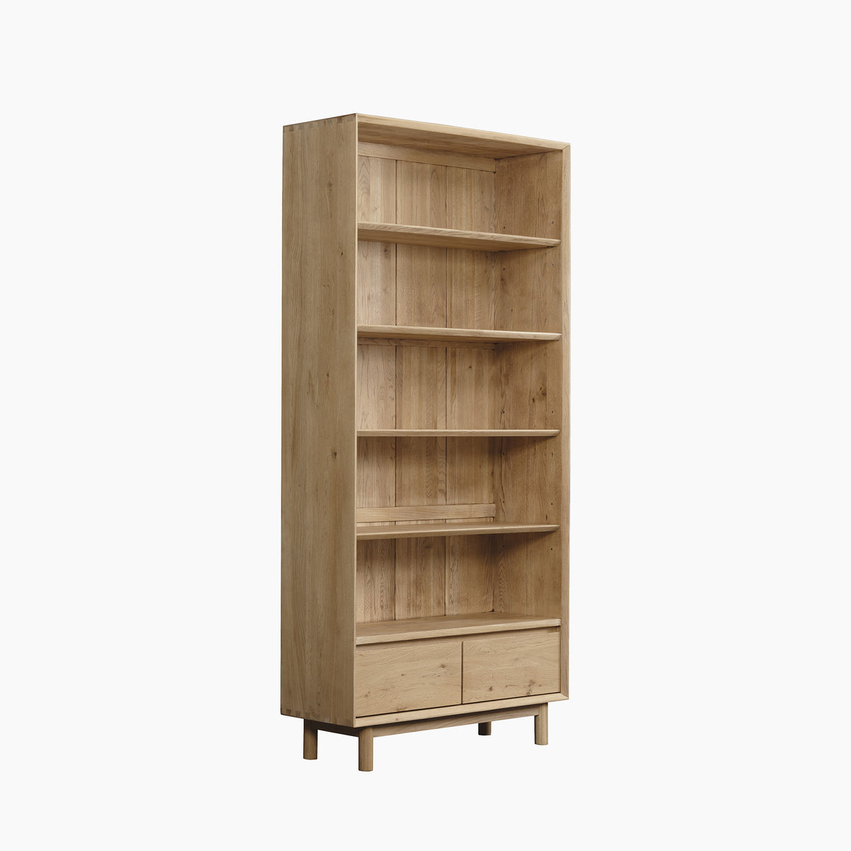 Oslo Bookcase in Light Oak, designed with five adjustable shelves and two bottom drawers, stands on short legs and is shown against a white background.