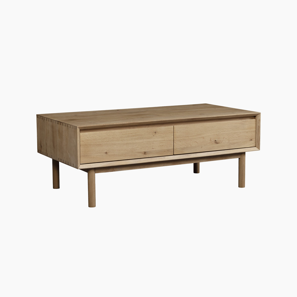 The Oslo Coffee Table with 4 Drawers in Light Oak features a rectangular design with four round legs and is shown against a white background.