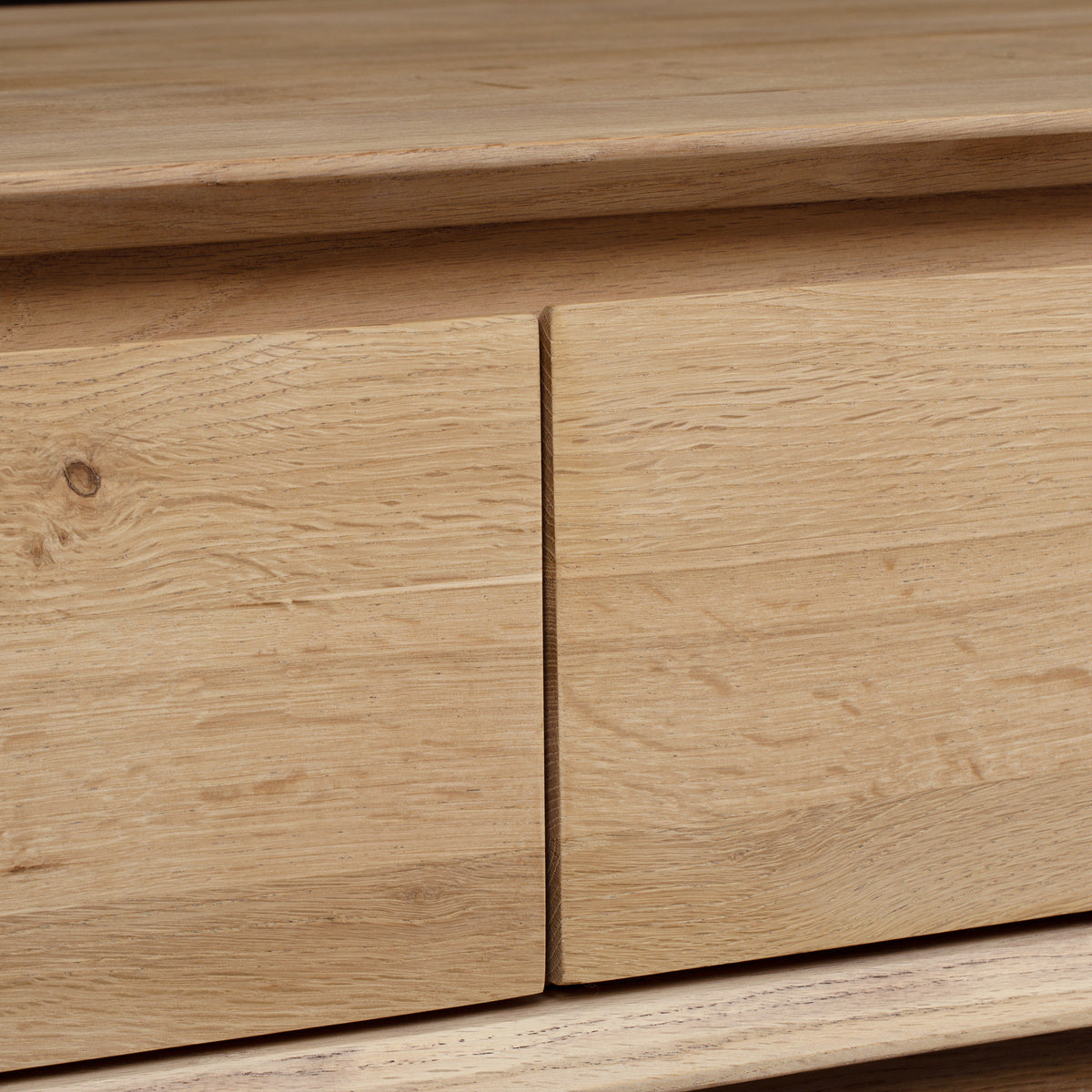 Close-up of two light oak cabinet drawers from the Oslo 9 Drawer Chest in Light Oak, featuring a natural grain finish and handleless design.