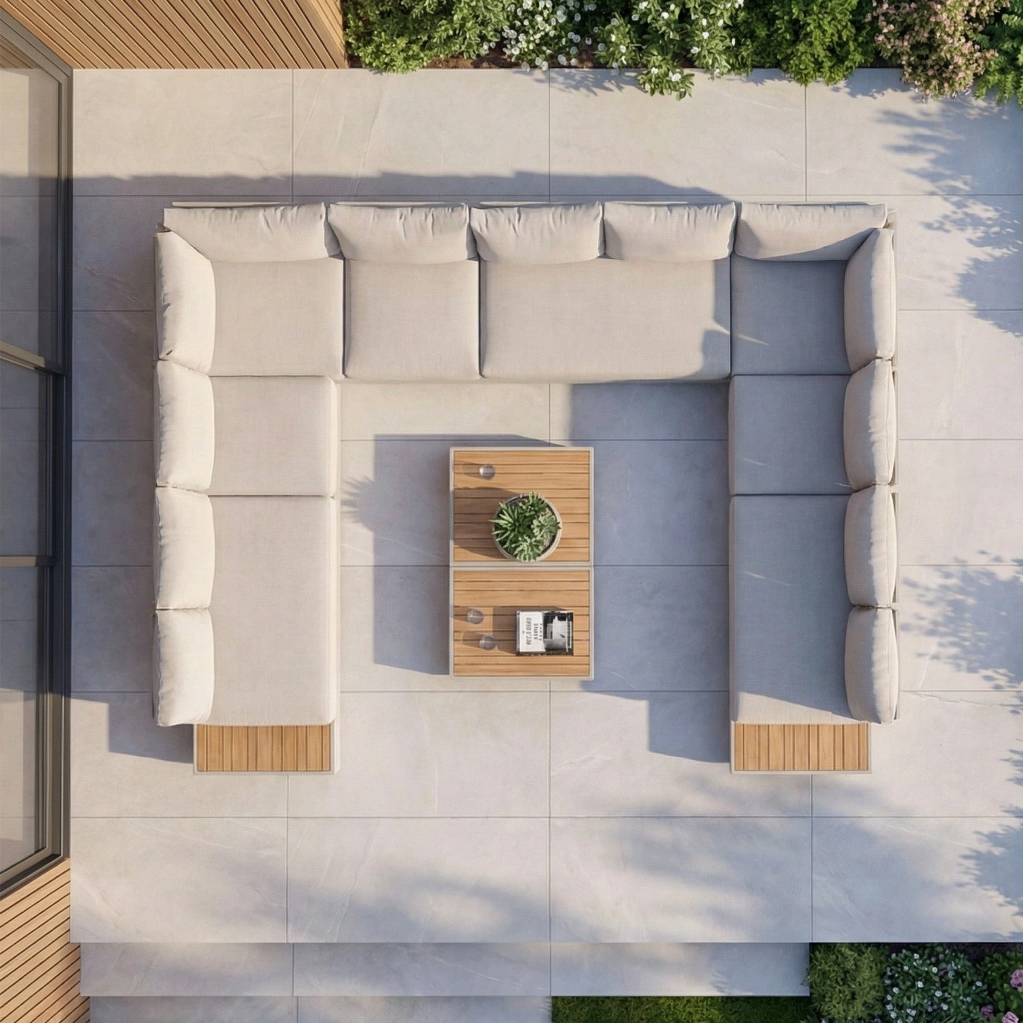 Top view of a luxury outdoor setup featuring the Panama Luxury Outdoor Large U-Shape Corner Sofa Set in Latte with teak coffee tables and plants on a tiled patio.