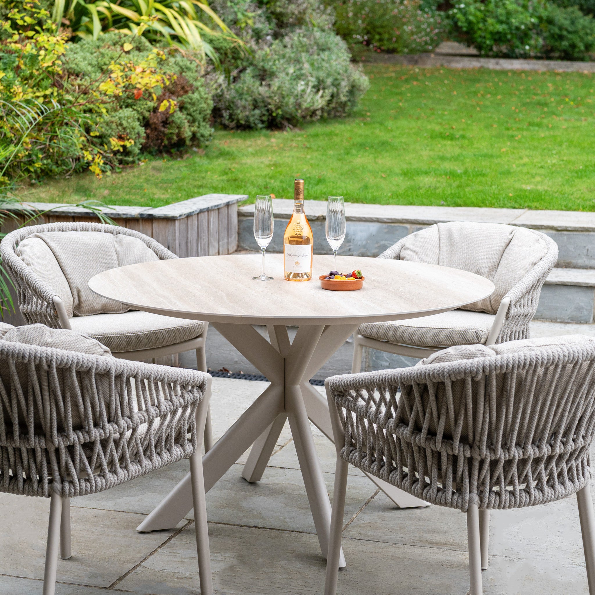 Enhance your garden with the Pello 4 Seat Round Dining Set with Albatross Table in Fawn—ideal for outdoor meals and relaxing moments. The perfect addition to your outdoor dining furniture collection.