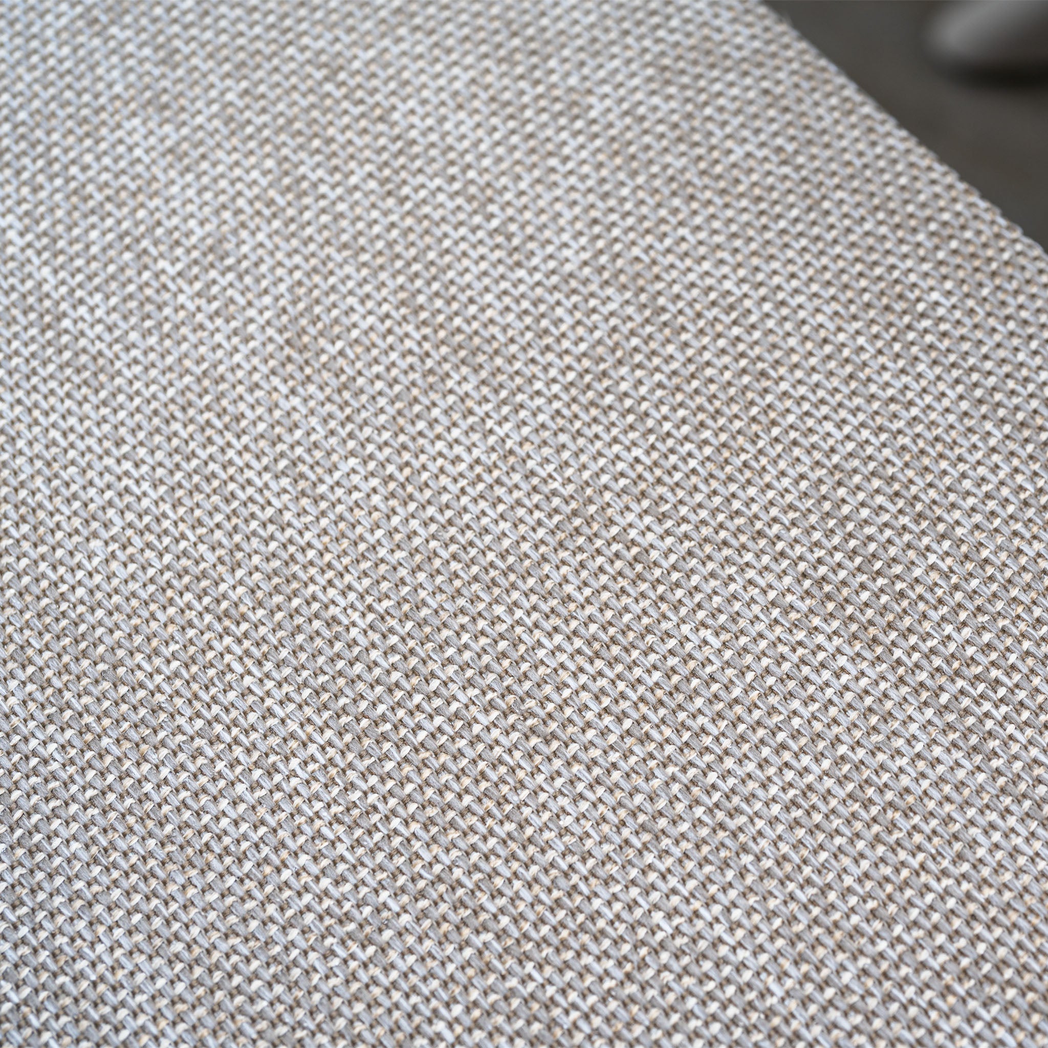 Close-up of beige and white woven fabric with a textured crisscross pattern, ideal for outdoor dining furniture like the Pello 4 Seat Round Dining Set with Albatross Table in Fawn.