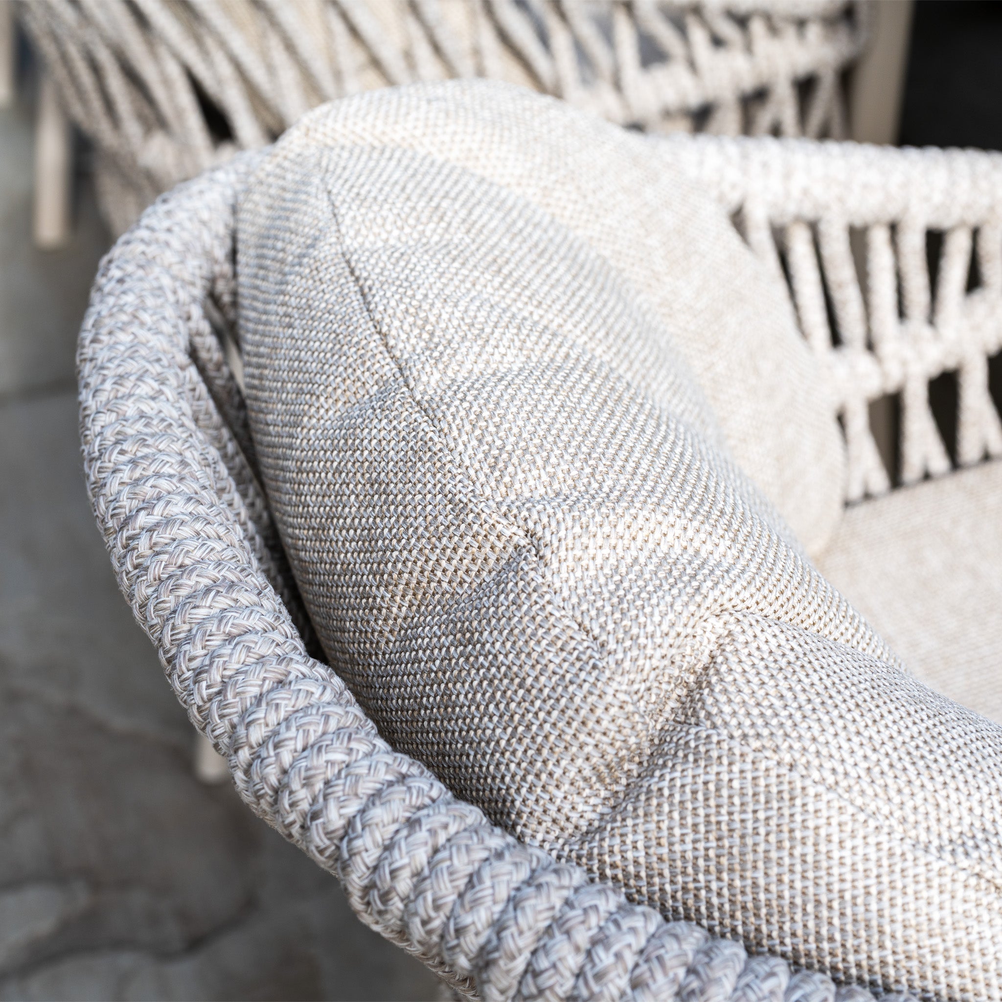 Close-up of the Pello 8 Seat Oval Dining Set with Albatross Extending Table in Fawn, featuring cushioned woven chairs in neutral tones—an elegant, durable choice for any garden or outdoor dining space.