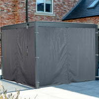 PergoSTET Side Curtains for Lite 3m x 4m Rectangular Pergola in Grey fully cover your metal gazebo frame beside a brick house, delivering superior weather protection for your patio setup.