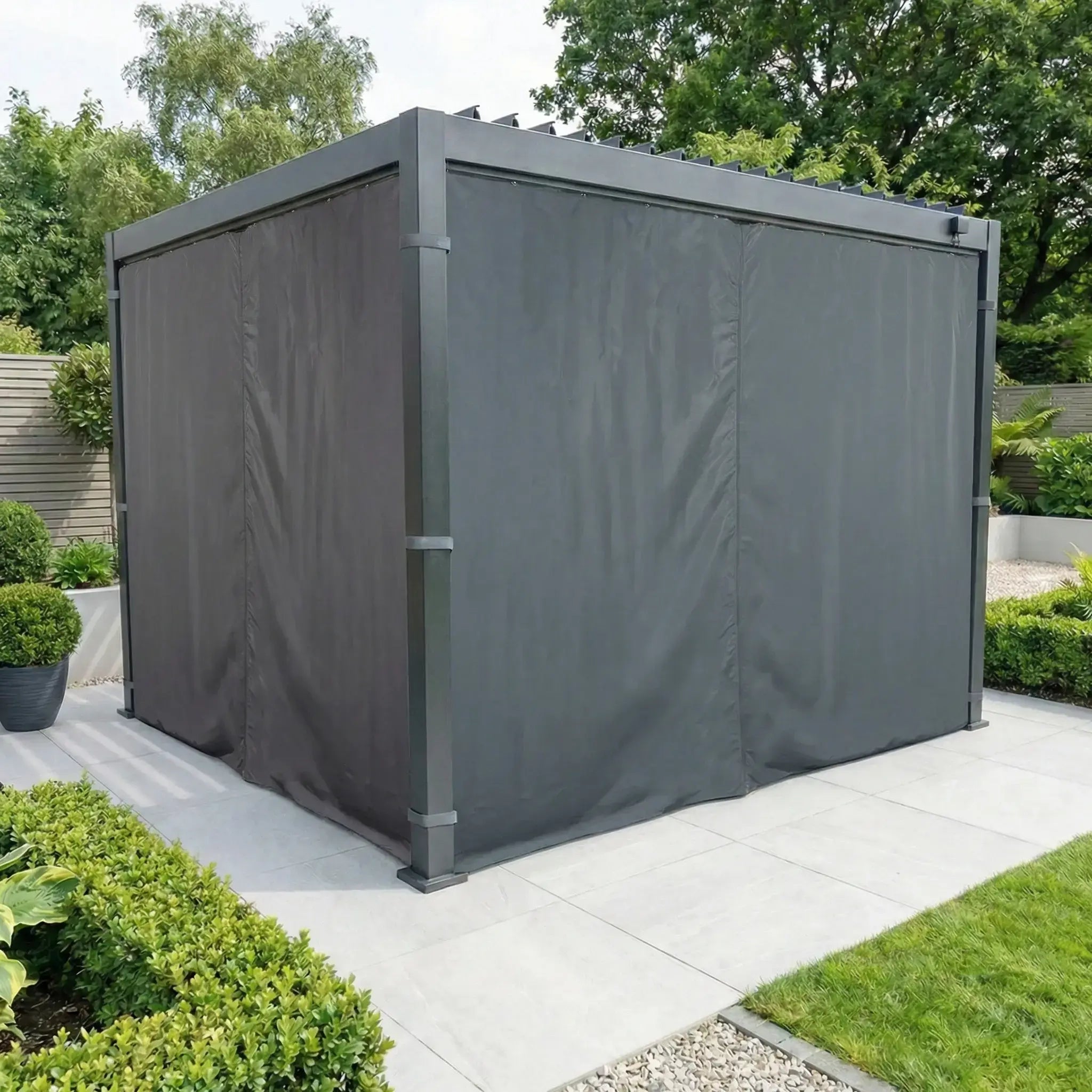 Enhance your patio with PergoSTET Side Curtains for Lite 2.4m x 3m Pergola in Grey—modern, weather-resistant fabric walls that create a stylish outdoor retreat surrounded by garden greenery.
