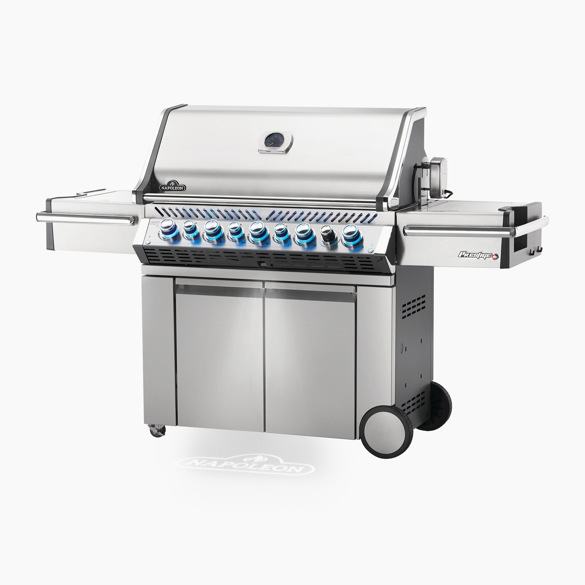 The Napoleon Prestige Pro 665 RSIB Gas Barbecue is a large stainless steel gas grill featuring six LED Spectrum NIGHT LIGHT™ control knobs, storage cabinets below, and side shelves. It also boasts infrared rear and side burners for versatile cooking options.