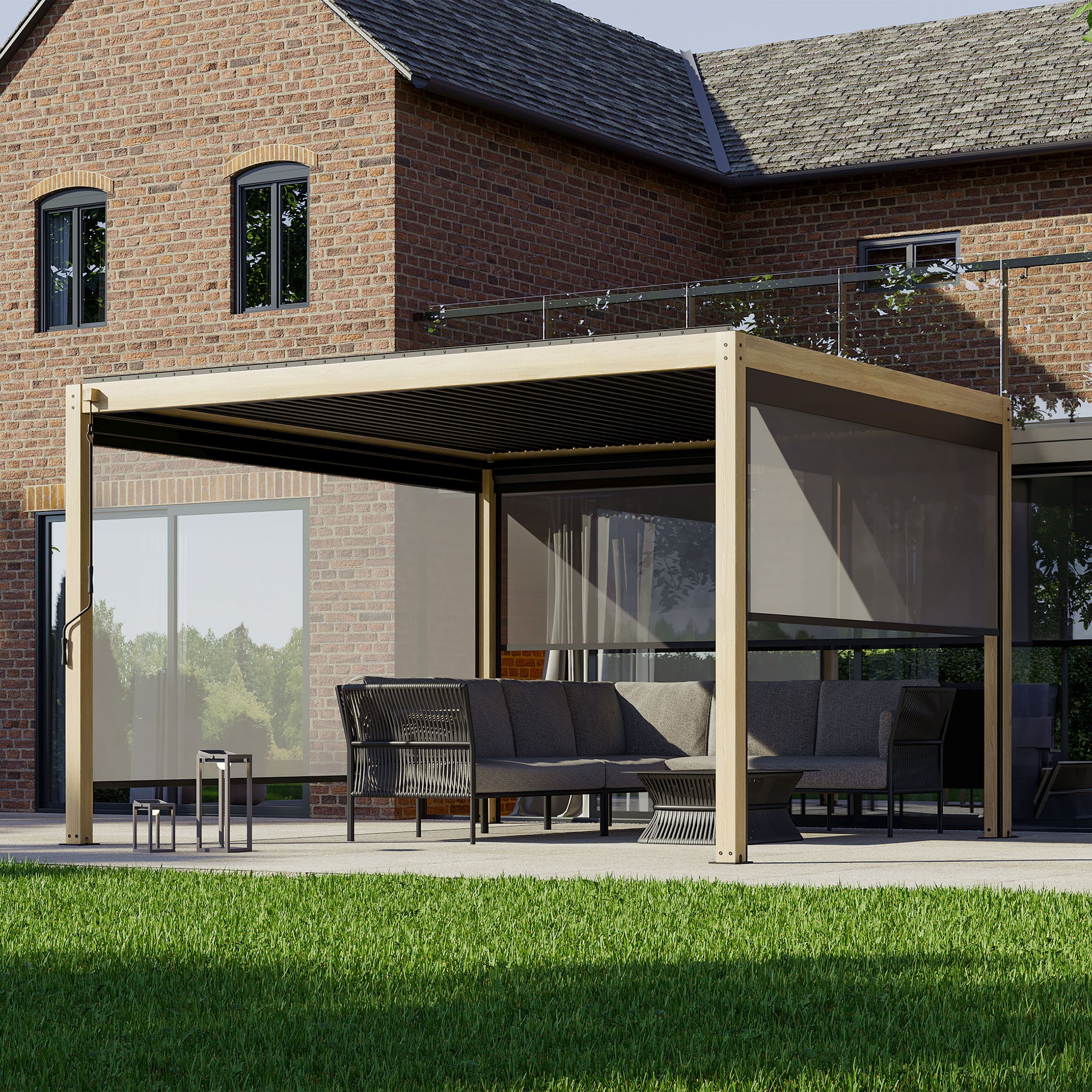 The patio showcases a PergoSTET Plus Pergola with adjustable louvres and LED lighting, forming a sleek seating space beside the brick house and providing a stunning view of the manicured lawn.