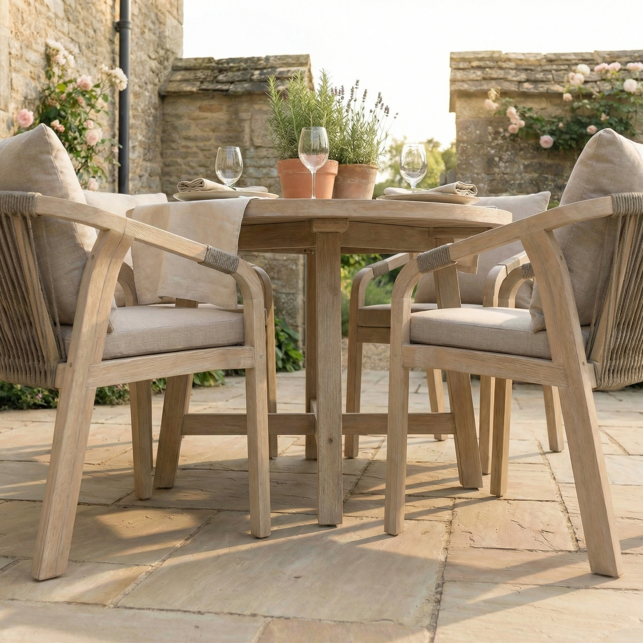 The Quay 4 Seat Round Dining Set in Mocha features four cushioned chairs and a stylish table—ideal outdoor patio furniture for gatherings on your terrace.