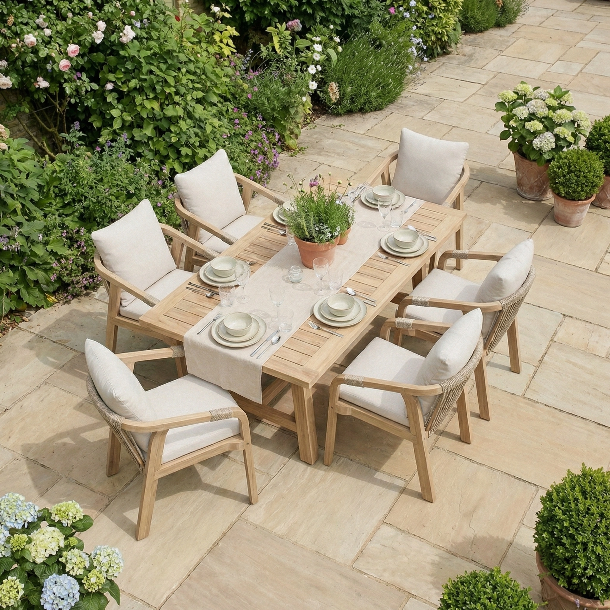 The Quay 6 Seat Rectangular Dining Set in Linen features a wooden table and six cushioned chairs, perfect for stylish outdoor dining on your garden patio.