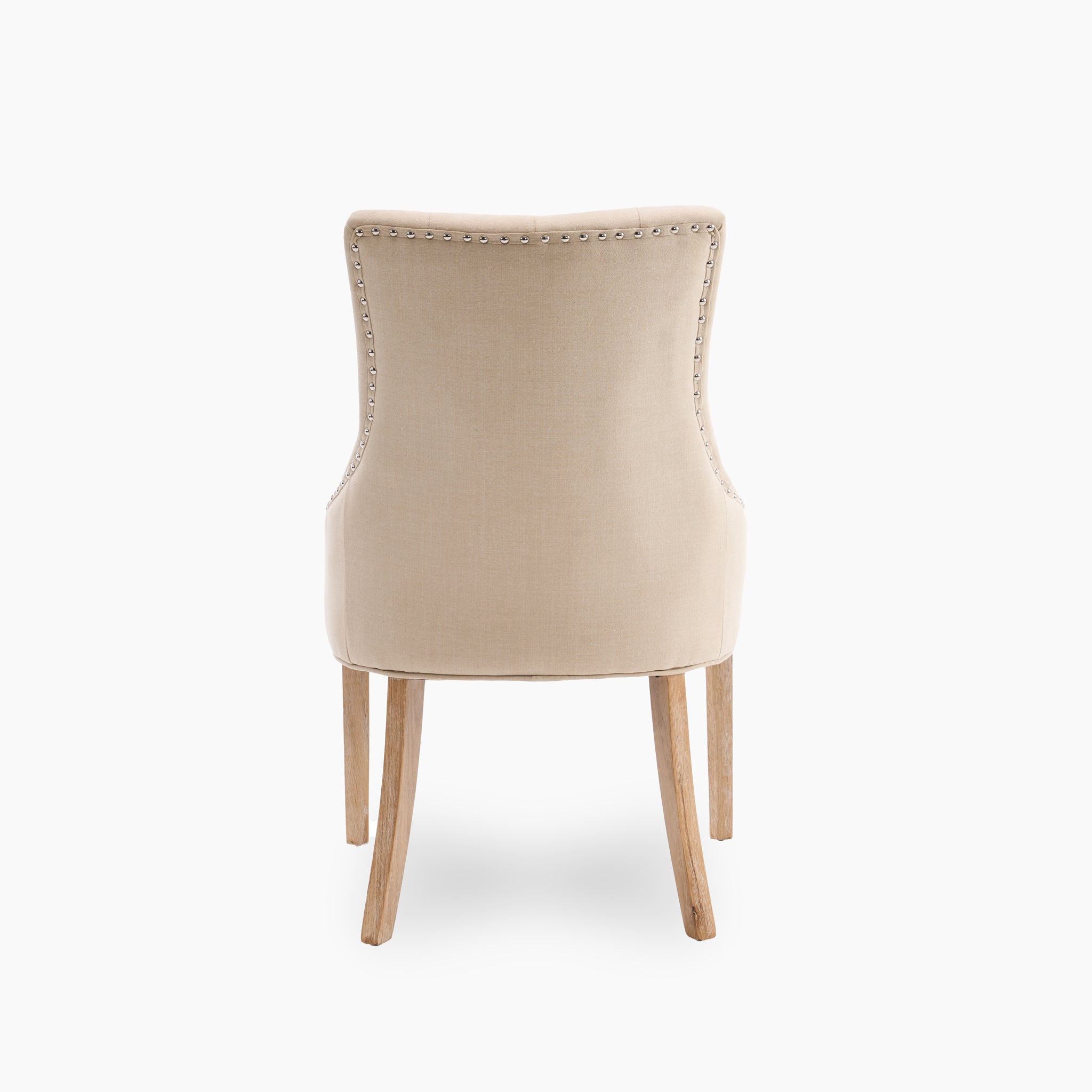 The Burford 8 Seat Extending Dining Set features Regent Chairs in beige upholstery with nailhead trim and wooden legs, perfect for complementing a natural oak table and enhancing your dining space.
