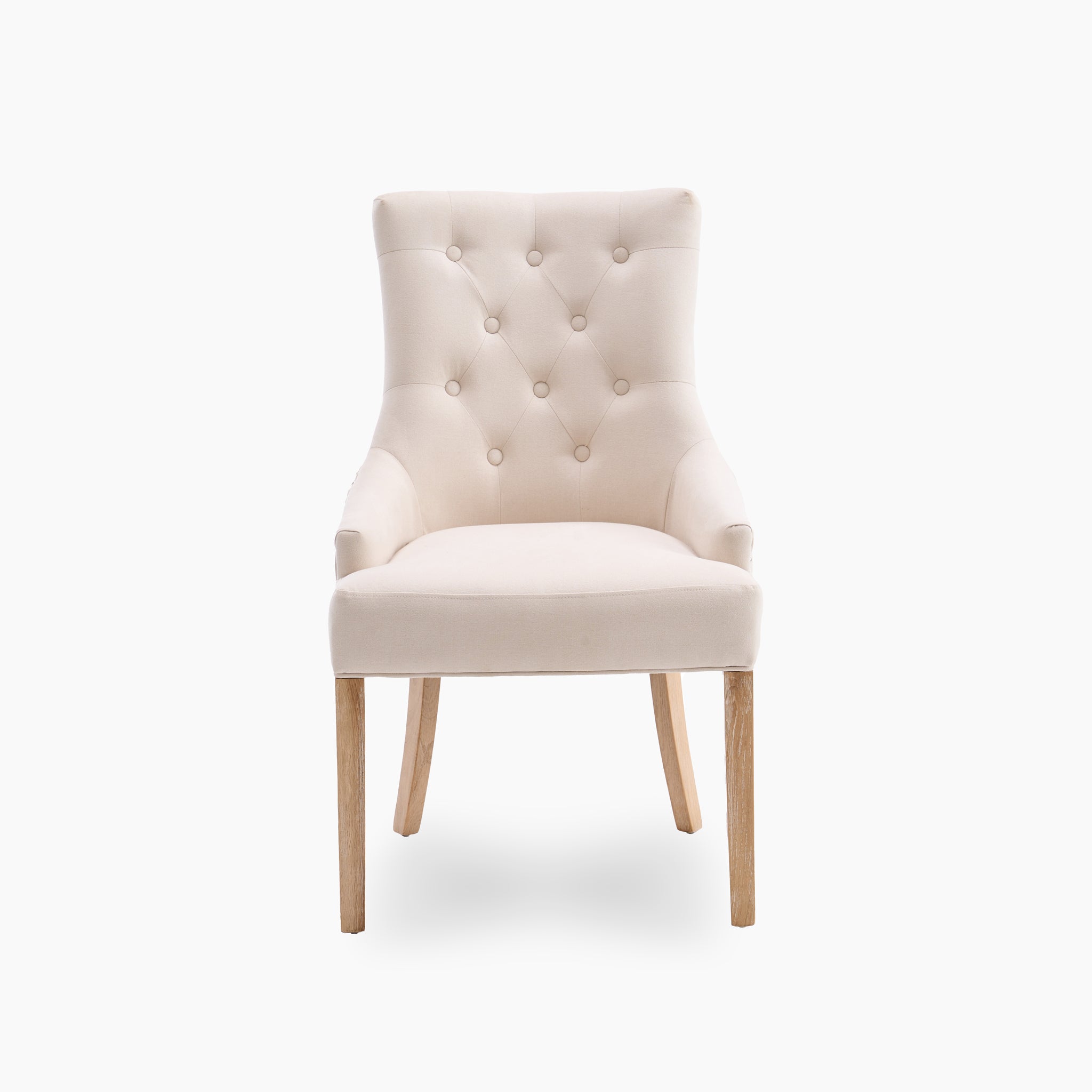 The cream-colored tufted accent chair with wooden legs complements the Burford 8 Seat Extending Dining Set with Regent Chairs in Natural Oak and Ivory, making it a perfect addition to your dining space.