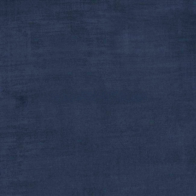 A royal blue velvet texture with subtle shading variations evokes luxury and comfort, reminiscent of a Chesterfield Velvet Armchair's classic elegance.