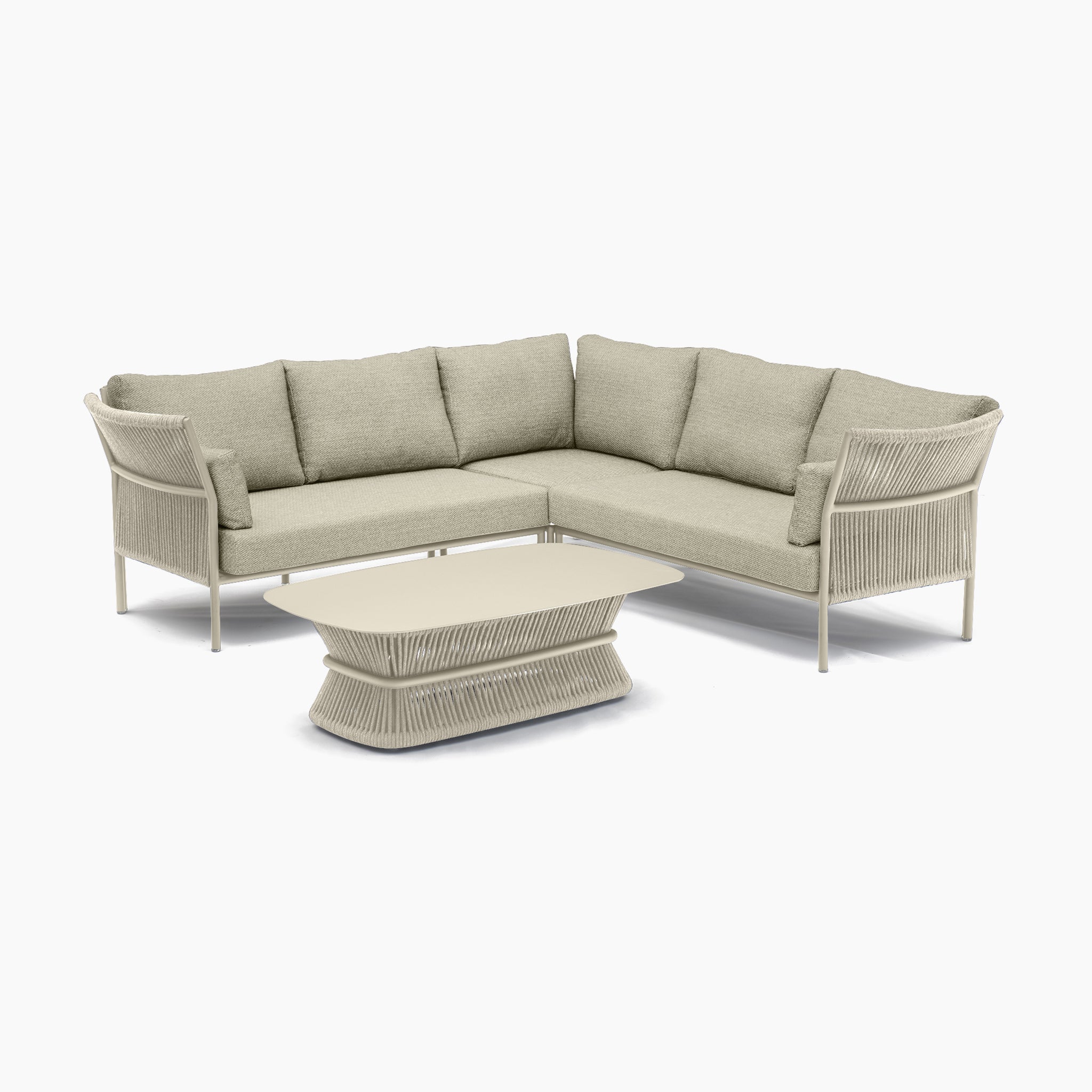 The Salina Corner Group Set with Aluminium Table in Latte features a beige L-shaped outdoor sectional sofa complemented by green cushions, and includes a matching beige coffee table. This weather-resistant outdoor furniture set is perfect for any patio.