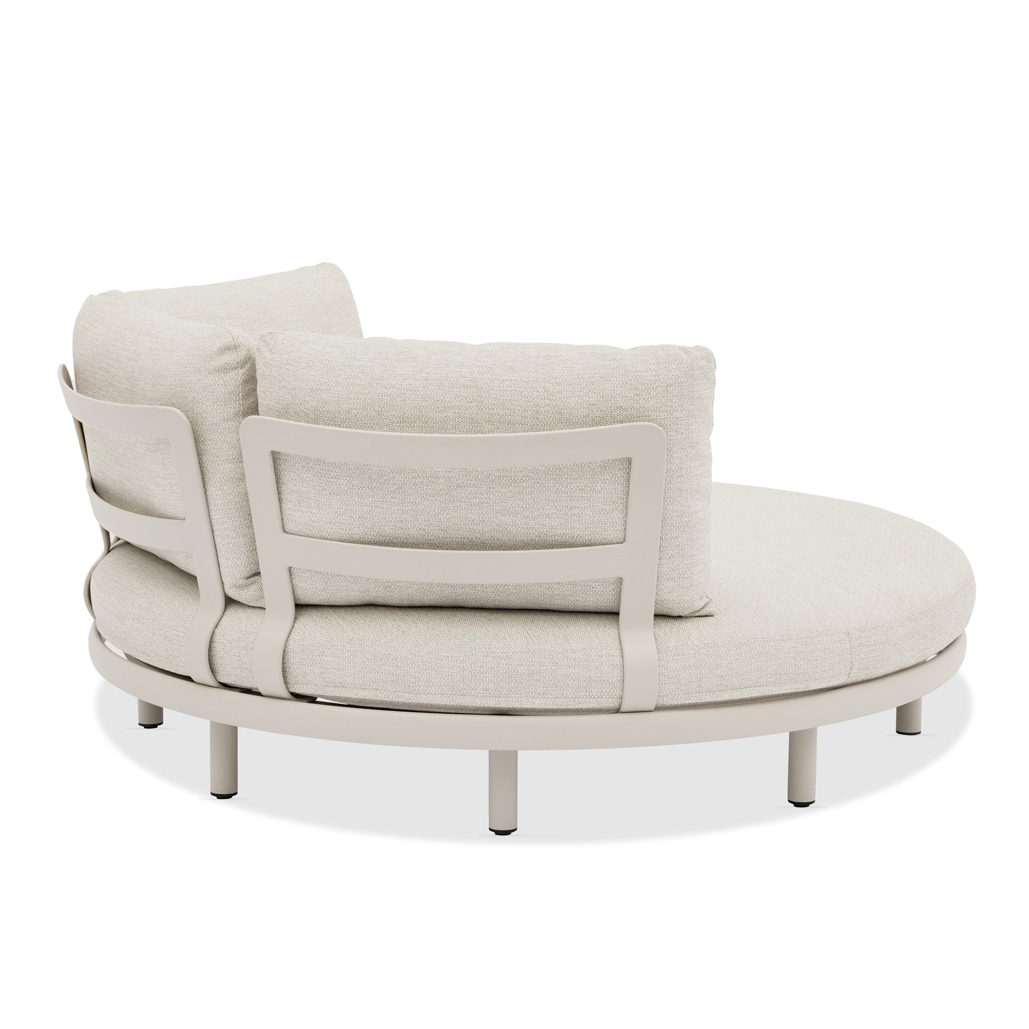 The Selene Daybed in Fawn is a round, light beige cushioned lounge chair with dual backrests and a metal frame—luxury outdoor furniture designed for stylish relaxation.