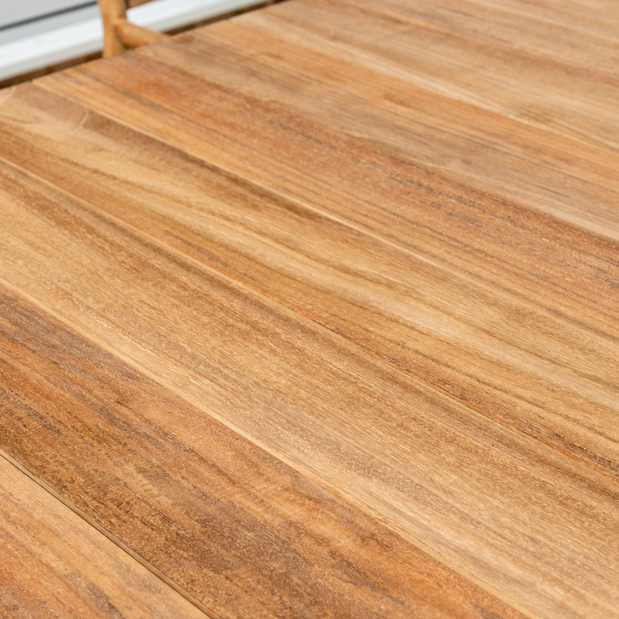 Close-up of the Siena 8 Seat Dining Set with Teak Table in Fawn, showing its smooth, polished teak surface and natural grain—ideal for stylish outdoor dining.