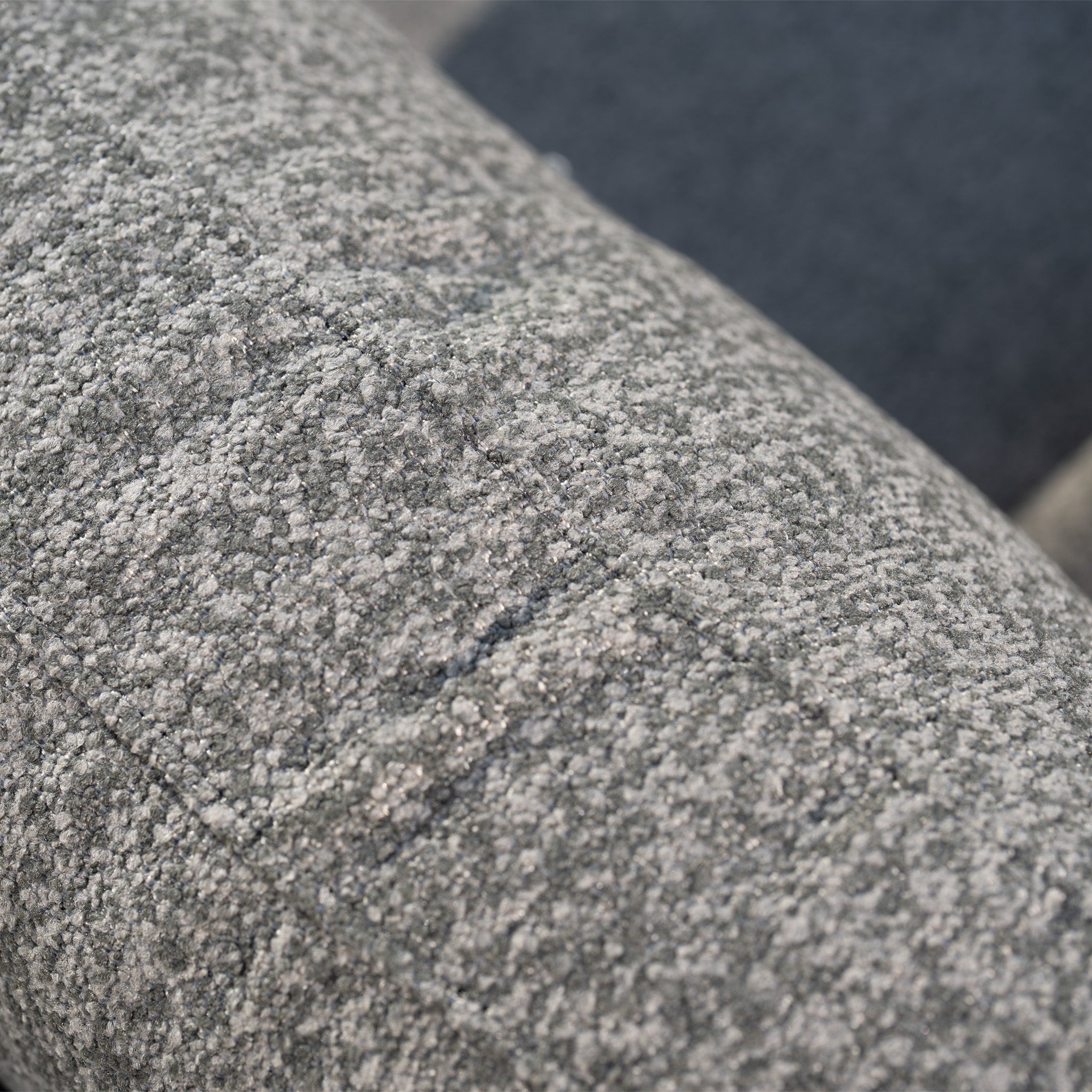 Close-up of textured gray fabric with stitched seams, ideal for weather-resistant cushions on the Sorelli U Shape Corner Sofa Set in Truffle—perfect for stylish outdoor entertaining.