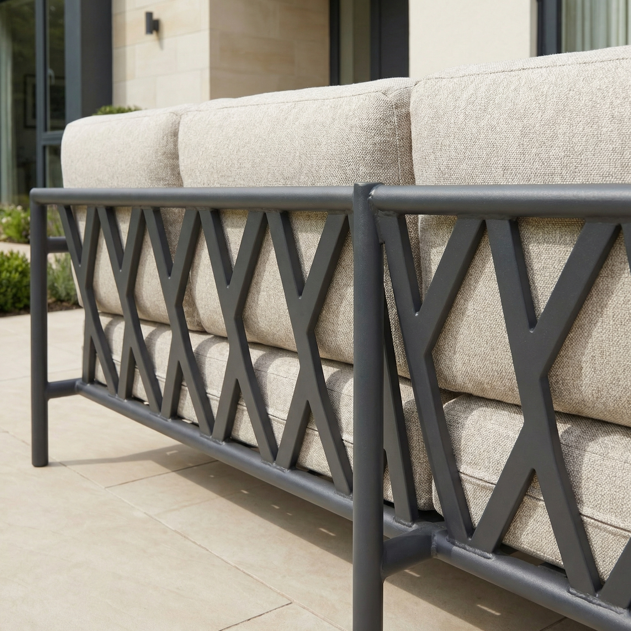 The Sorelli U Shape Corner Sofa Set in Truffle features weather-resistant cushions and a dark metal X-patterned backrest, ideal for outdoor entertaining on your patio.
