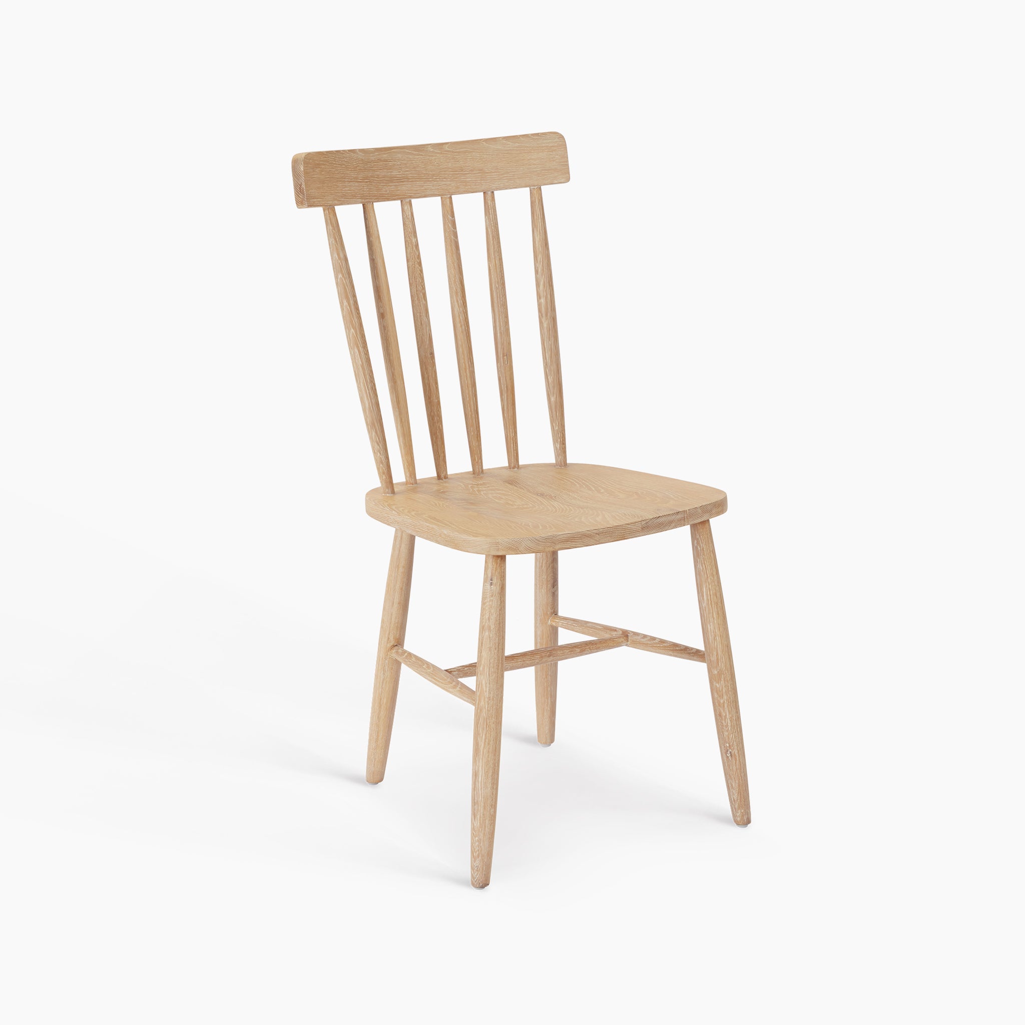The Burford Set of 2 Spindleback Dining Chairs in Natural Oak features slatted backrests and four legs, making an elegant choice for lovers of oak dining chairs. Shown on a white background.