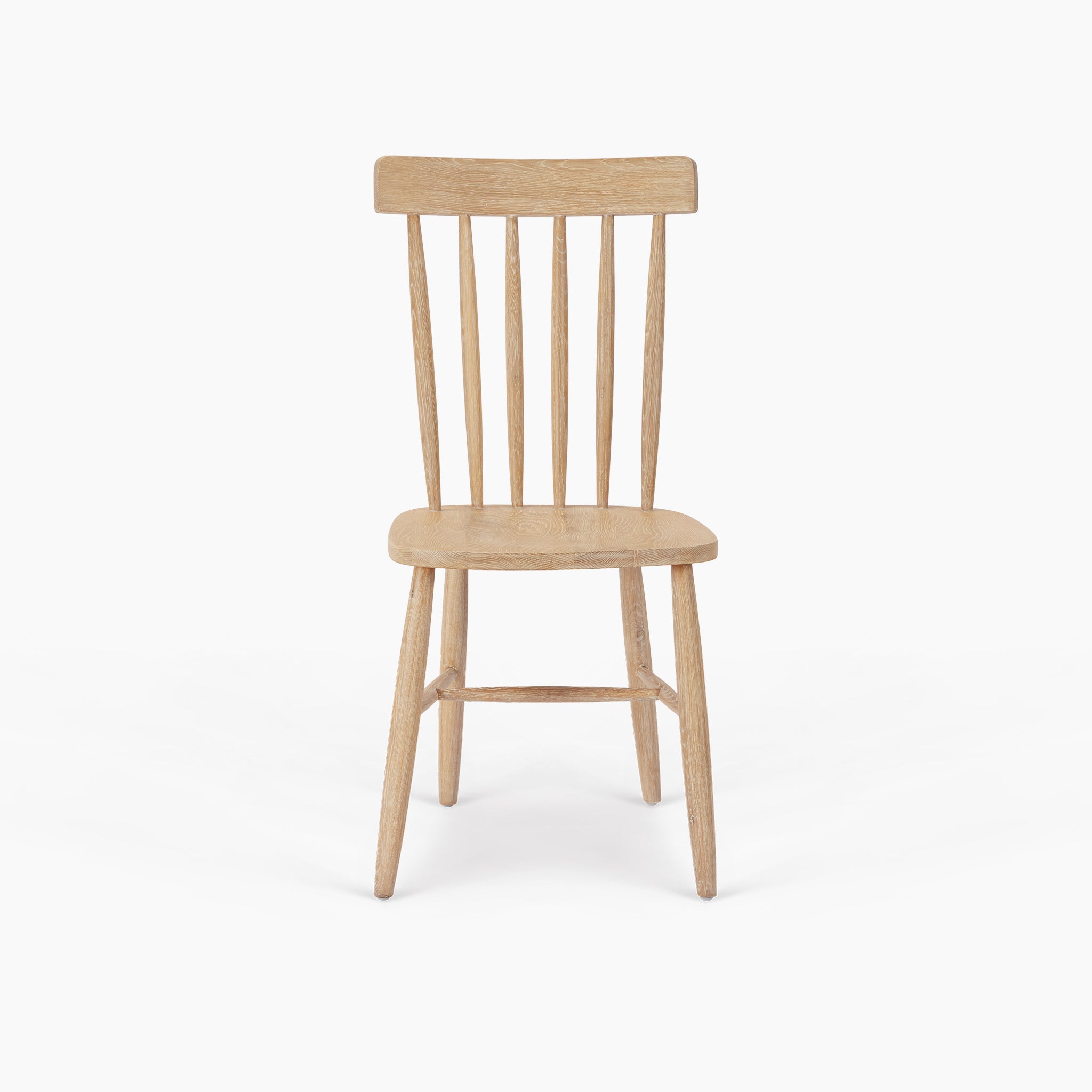 The Burford Set of 2 Spindleback Dining Chairs in Natural Oak features light wooden chairs with slatted backs, shown from the front against a white background.