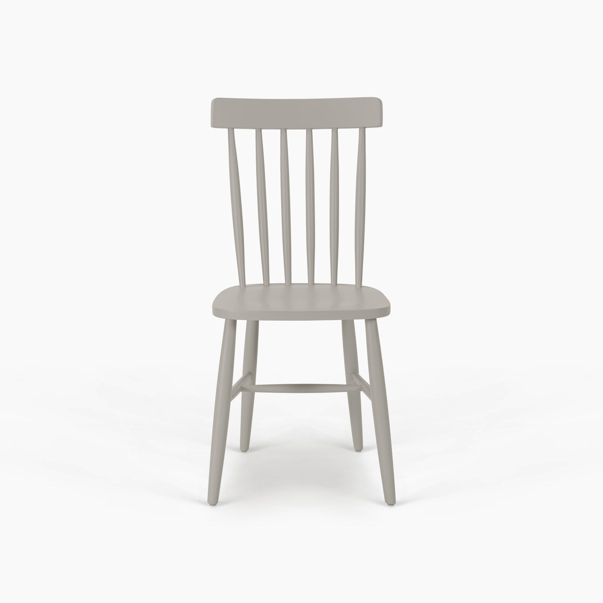 The Burford Set of 2 Spindleback Dining Chairs in Pebble Grey features light gray wood and slatted backrests, inspired by modern country style, shown from the front against a white background.