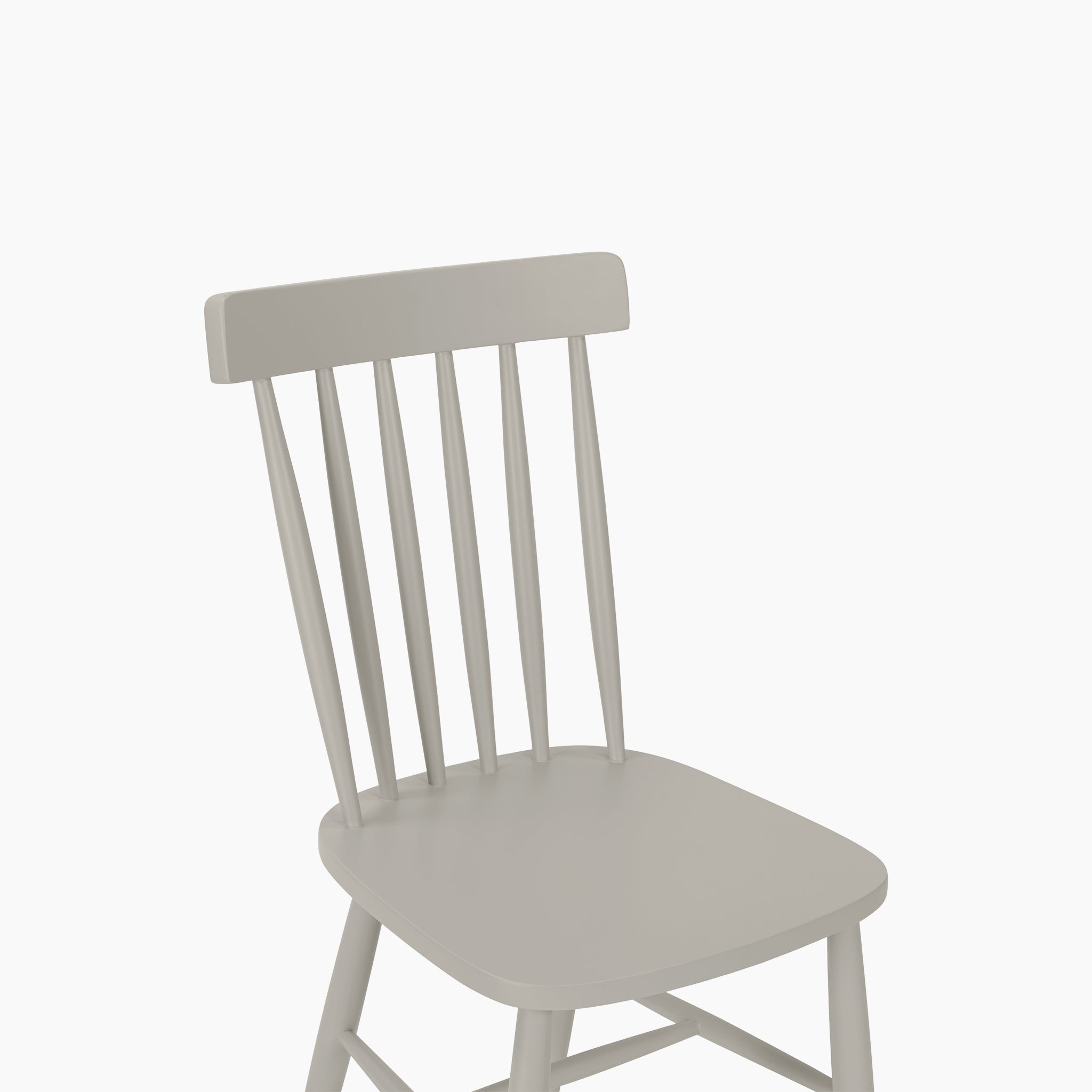 The Burford Set of 2 Spindleback Dining Chairs in Pebble Grey features slatted backrests, displayed against a plain white background.