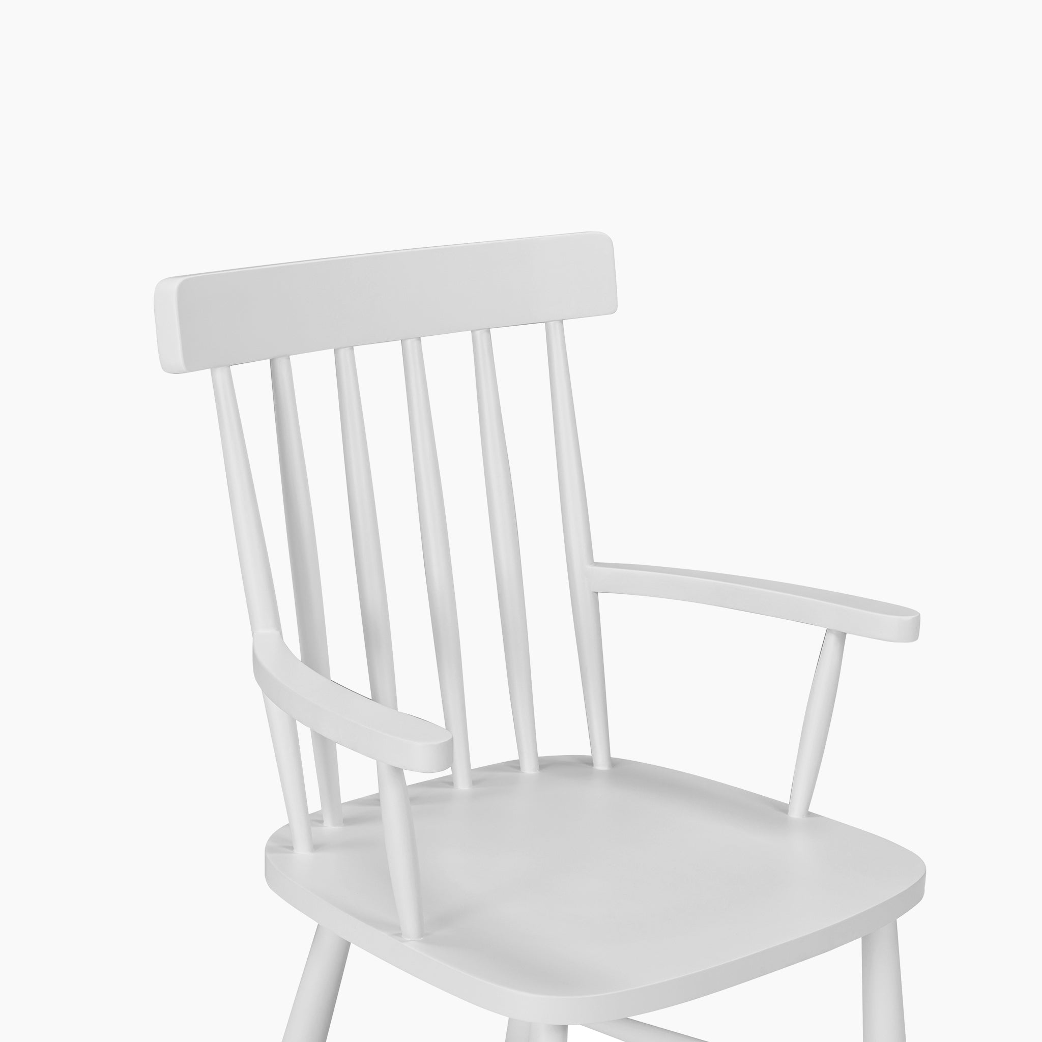The Burford Spindleback Dining Chair with Armrest in Warm White features a slatted backrest and classic design, making it a stylish choice for dining rooms with plain white backgrounds.