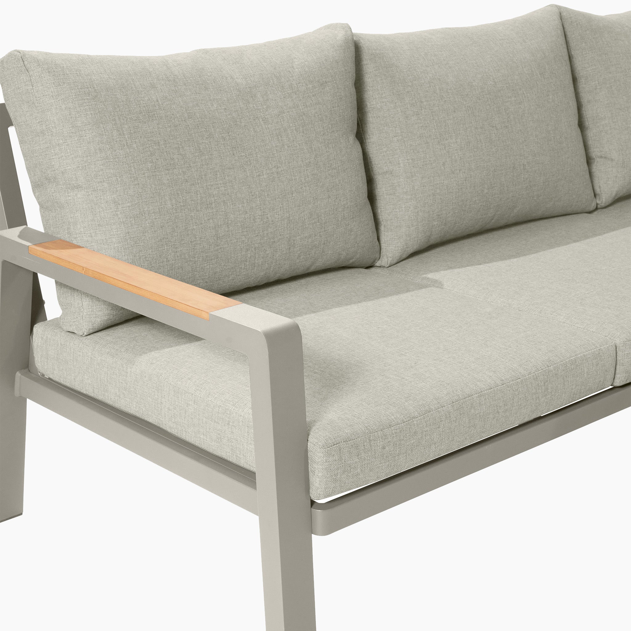 The Pacific Lifestyle - Stockholm Corner Set in Limestone features a light green cushion, a light grey metal frame, and teak wood armrest detailing, making it a perfect addition to your garden furniture collection.