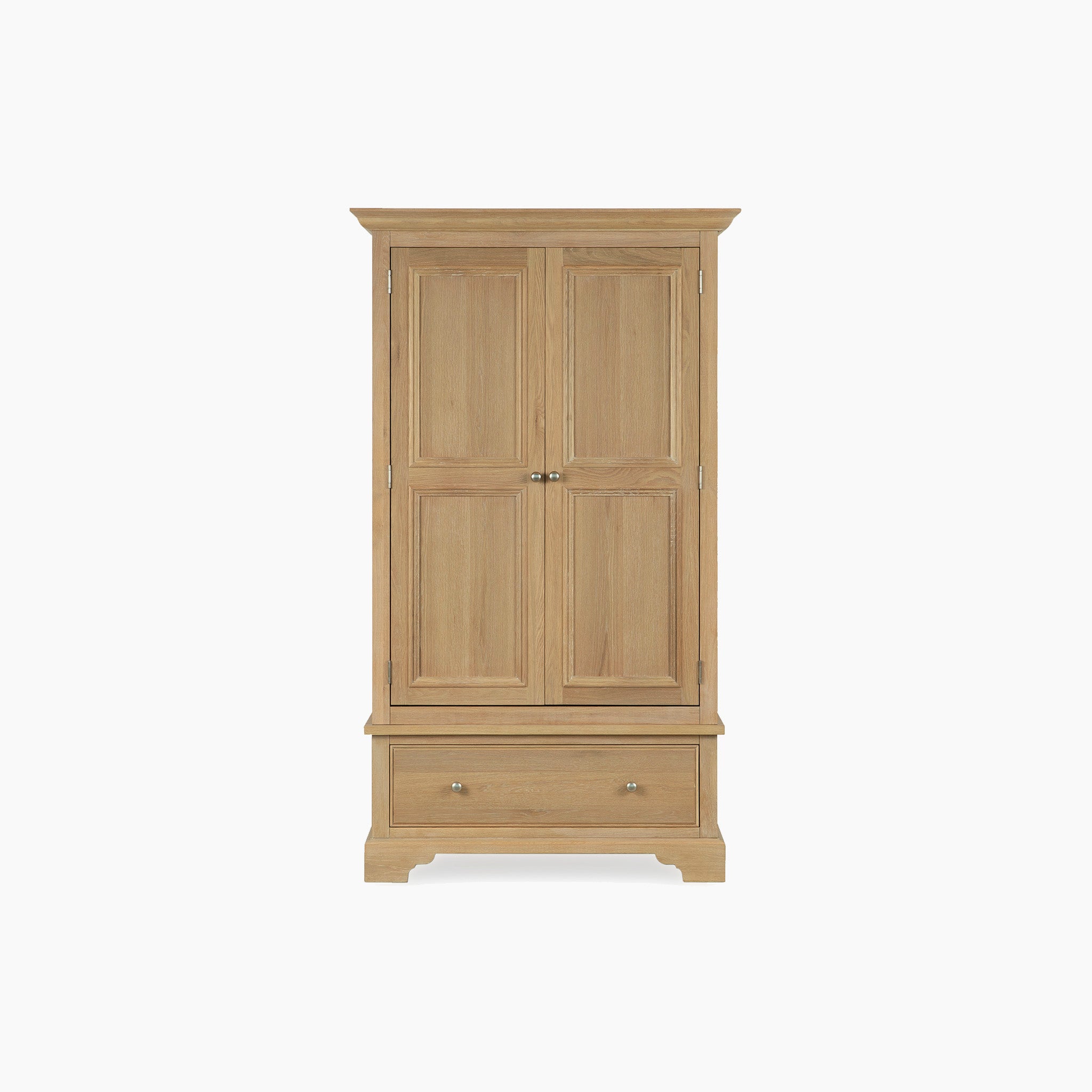 The Amberley Double Wardrobe in Light Oak features double doors and a bottom drawer, crafted from solid oak in a timeless bedroom furniture style, shown against a plain white background.