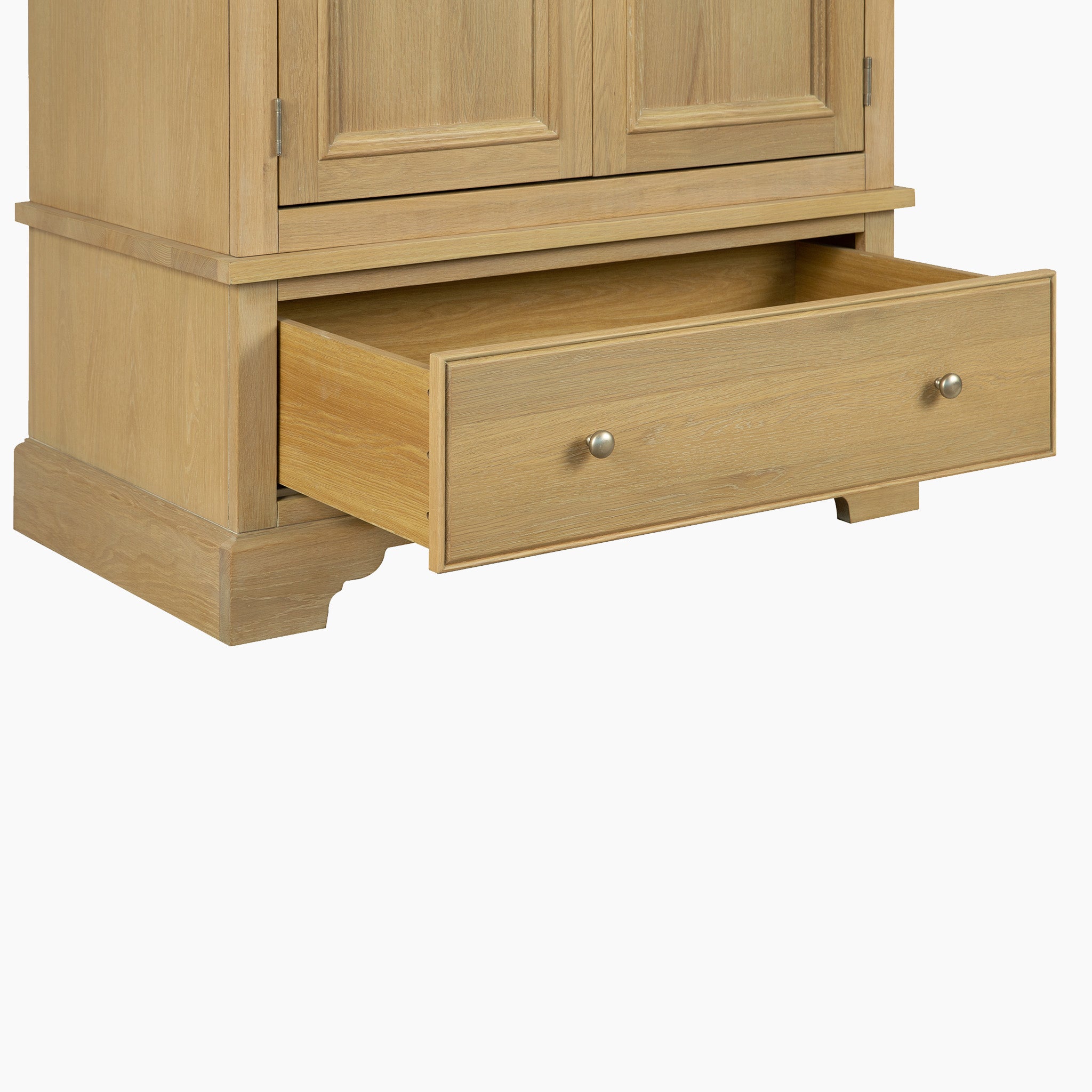 The Amberley Double Wardrobe in Light Oak features metal knobs and an open lower drawer, shown against a white background.