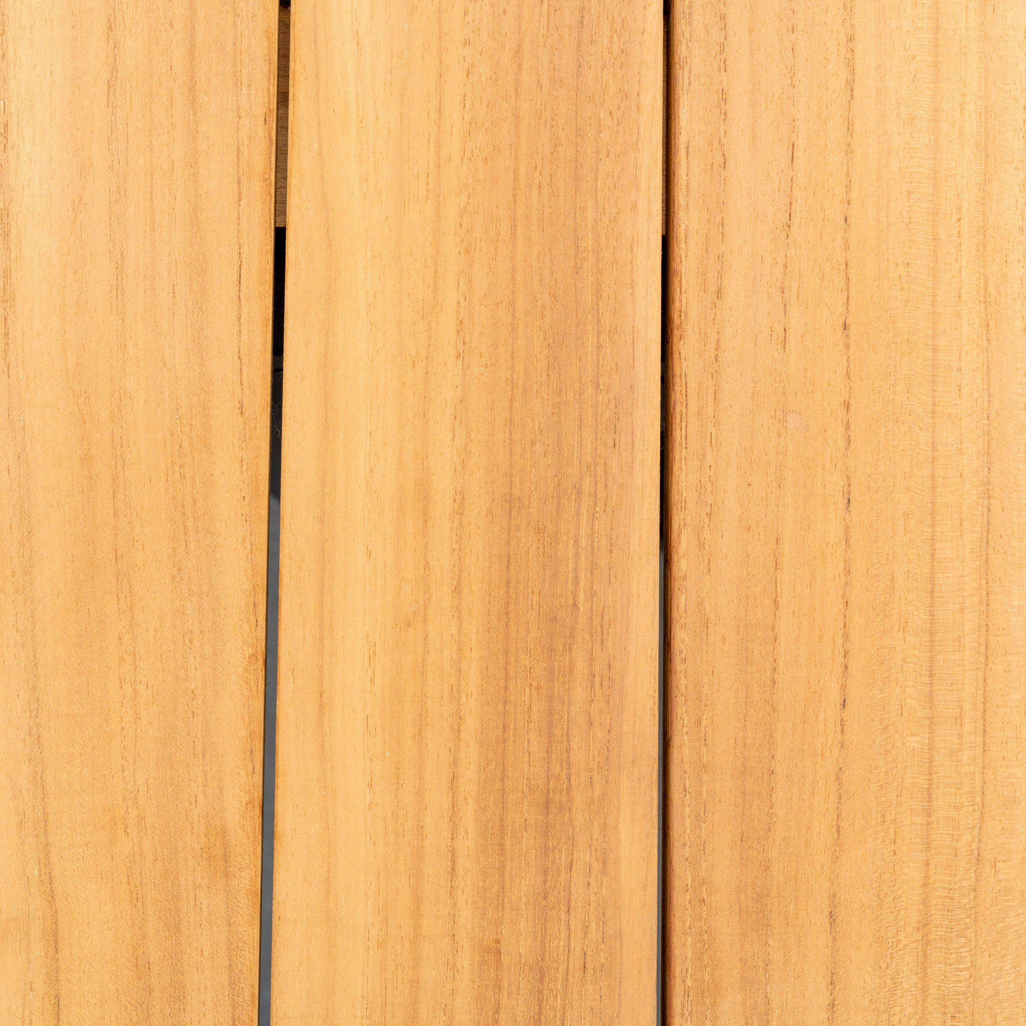 Close-up of light brown wooden planks with visible grain patterns and small gaps between the boards, embodying the natural charm of the Luna 8 Seat Outdoor Fabric Extending Teak Dining Set in Oyster Grey.