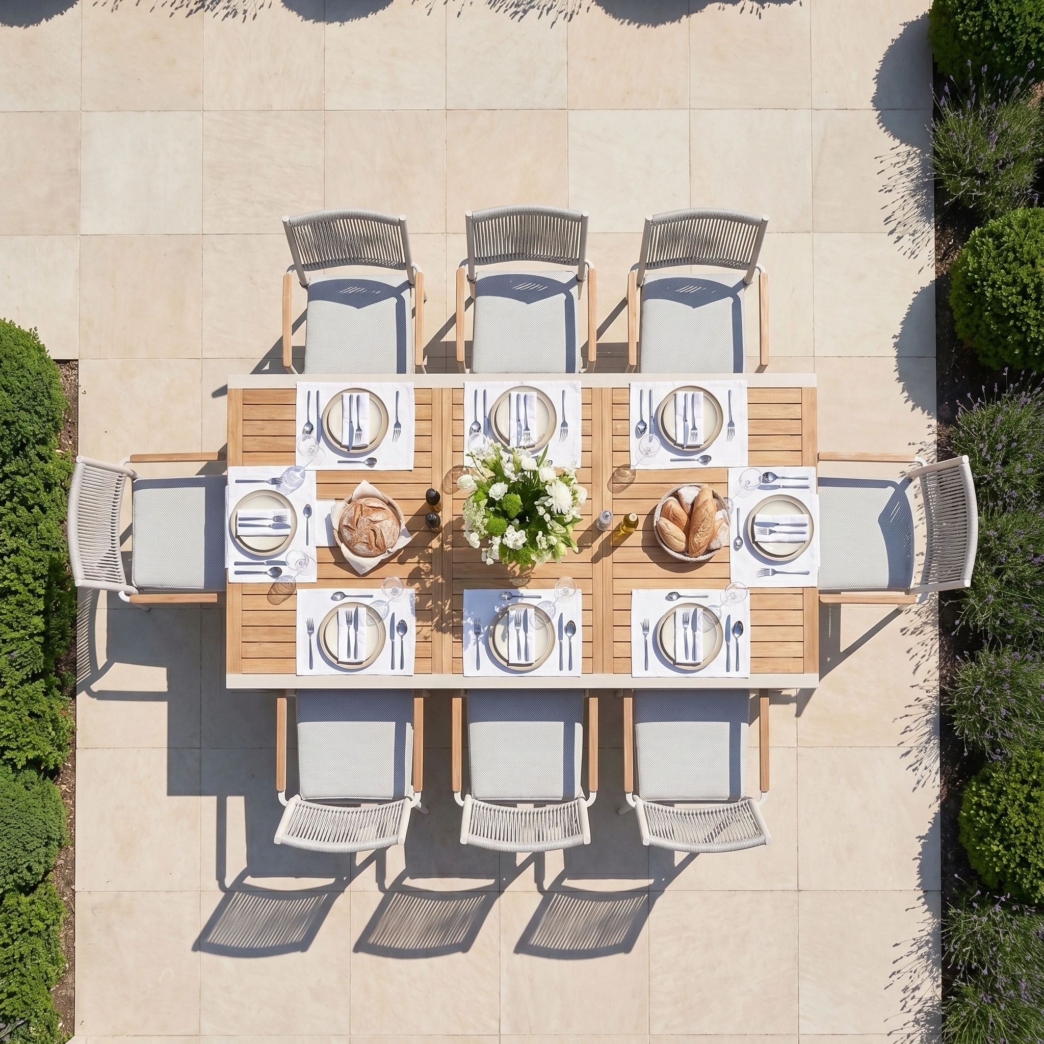 The Tellaro 8 Seat Extending Dining Set with Teak Table in Latte seats eight, featuring cushioned chairs and a sturdy aluminium frame for lasting outdoor elegance.