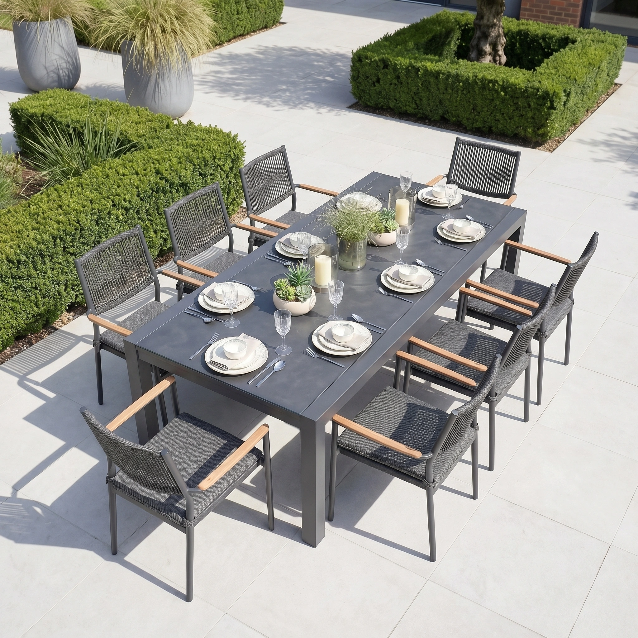 The Tellaro 8 Seat Extending Dining Set with Ceramic Table in Grey features a sleek aluminium frame for durability and style, making it perfect for outdoor gatherings on any patio.