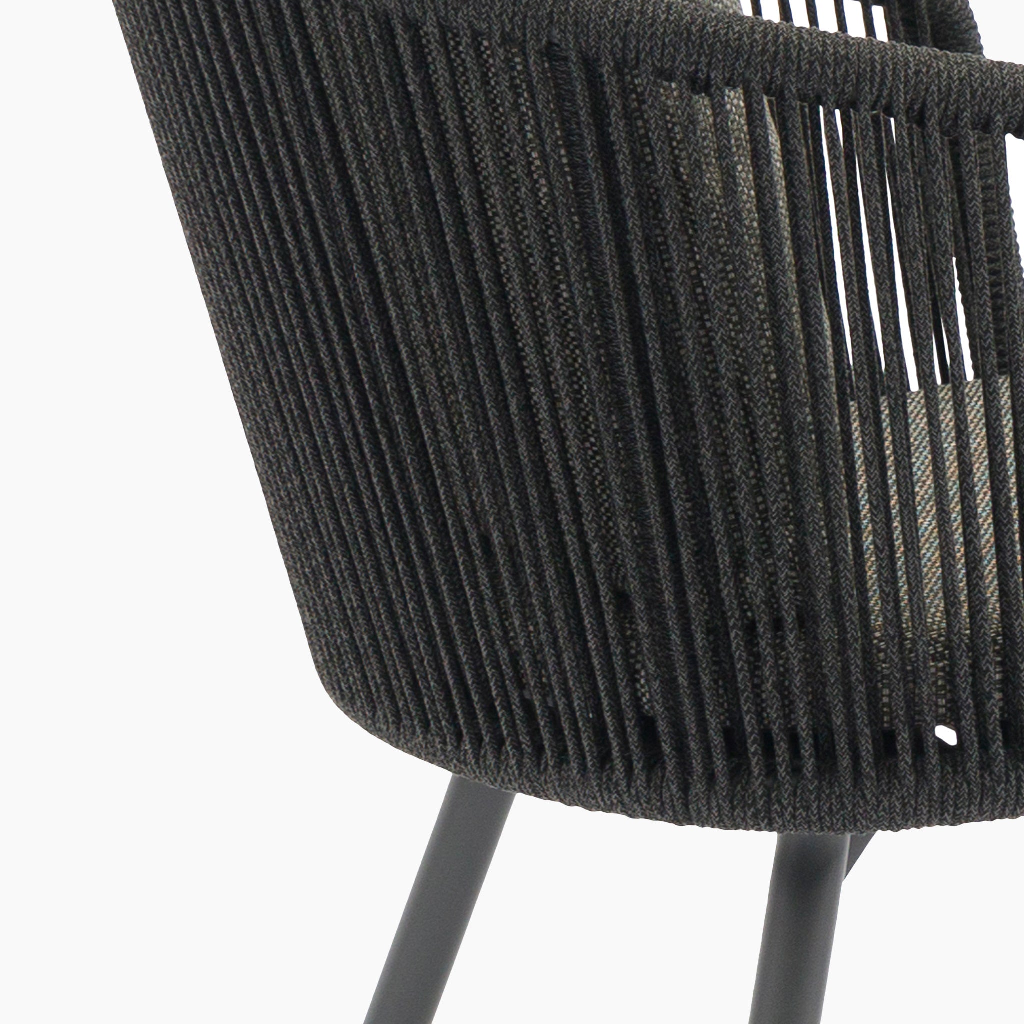 Close-up of a modern chair with woven black rope backrest and metal legs, from the Dekota 6 Seat Rope Dining Set with Albatross Extending Table in Charcoal, shown against a white background.