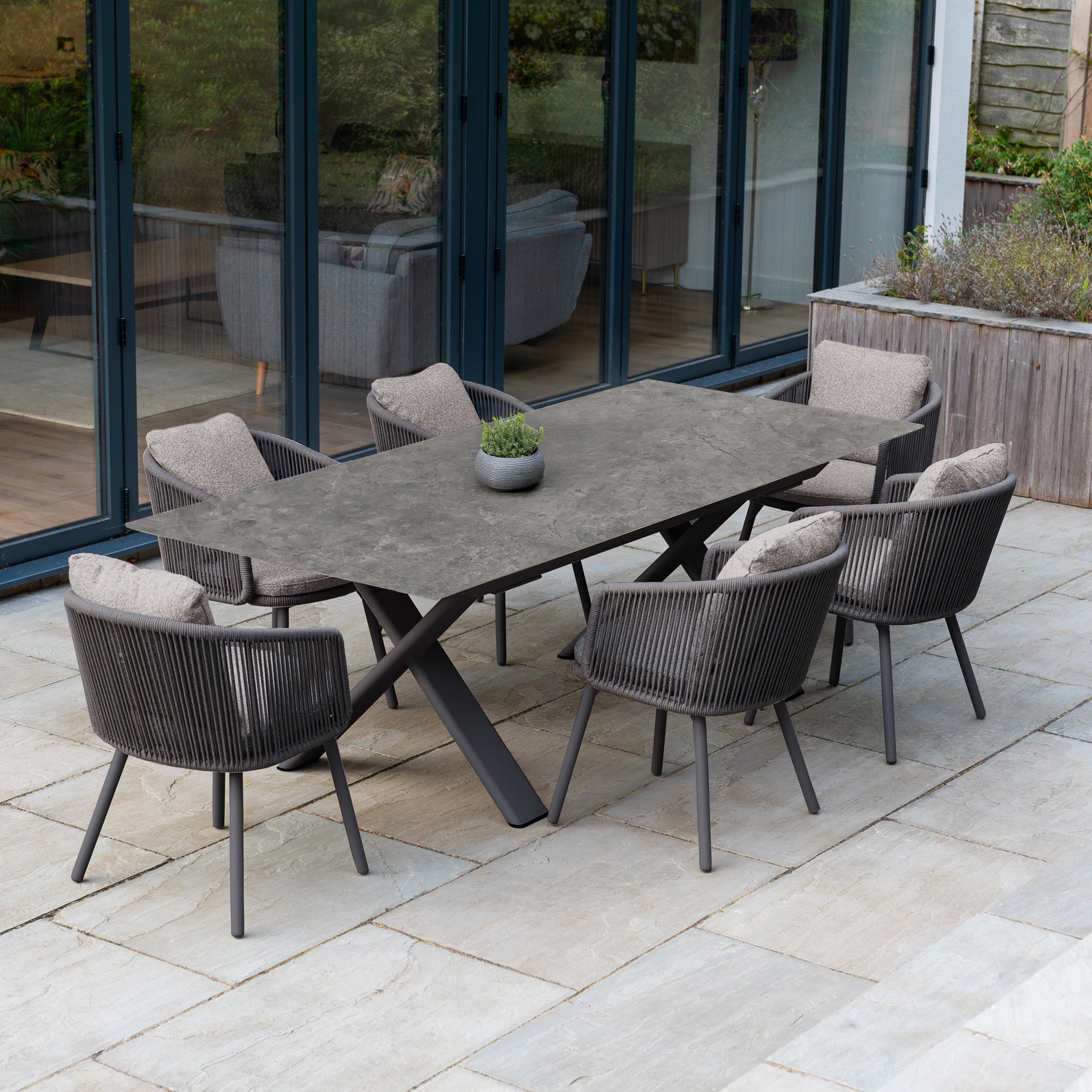 Theia 6 Seat Rope Dining Set with Albatross Extending Table in Truffle—perfect for stylish patio gatherings with a spacious rectangular table and comfortable seating for six.