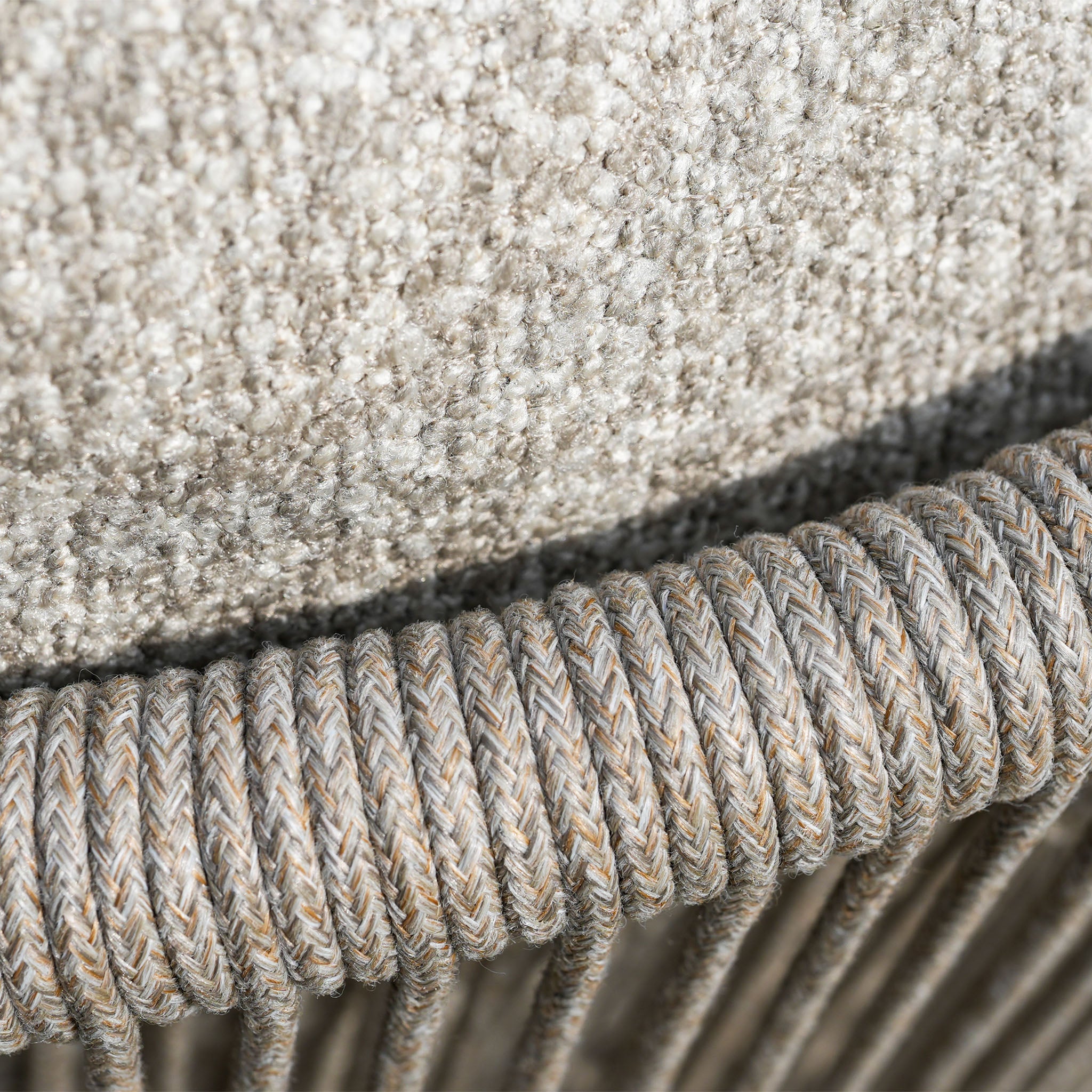 Close-up of textured oatmeal upholstery above coiled rope detail, highlighting the refined craftsmanship of the Theia 8 Seat Oval Rope Dining Set with Albatross Extending Table.